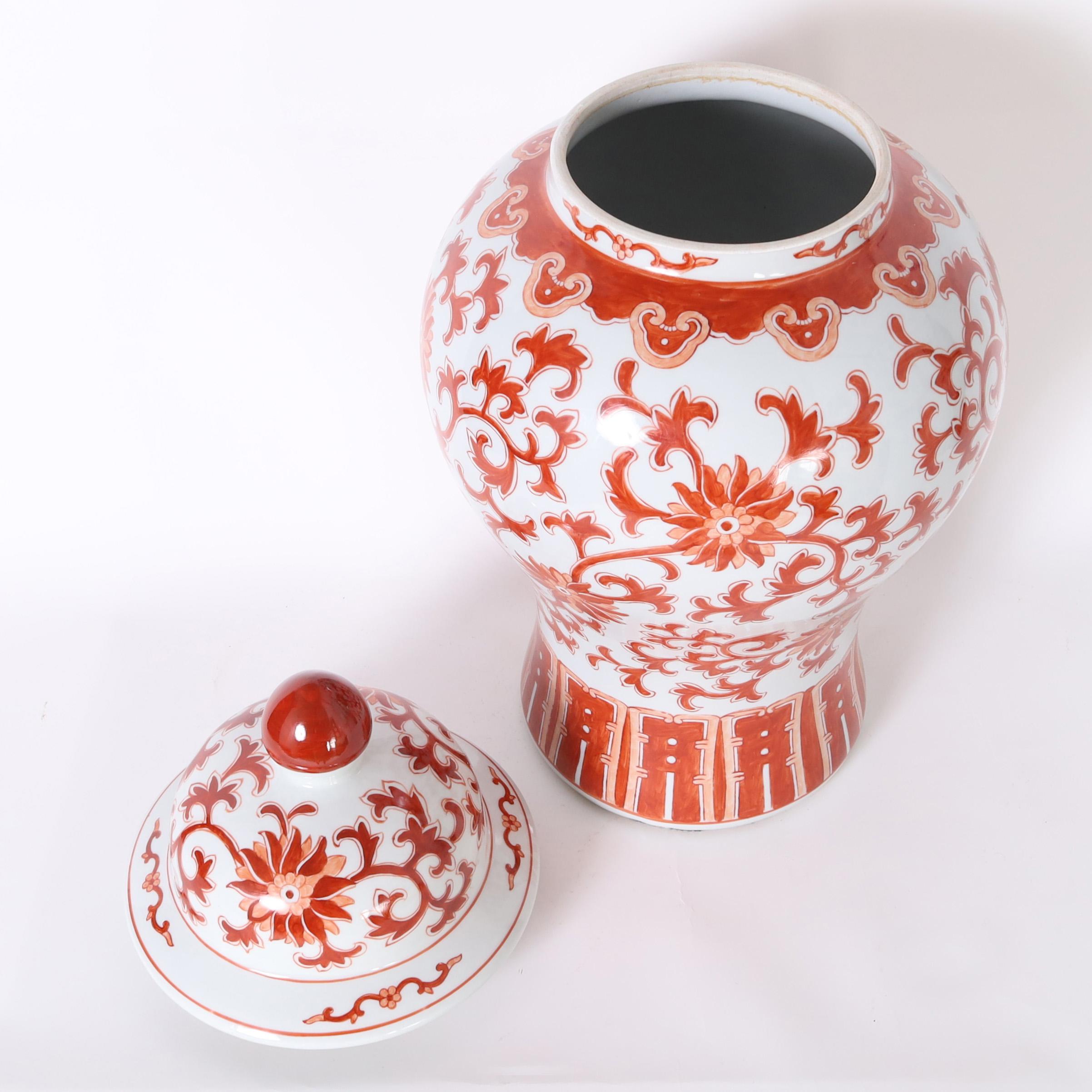 Pair of Red and White Porcelain Lidded Urns or Jars For Sale 1