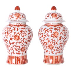 Pair of Red and White Porcelain Lidded Urns or Jars