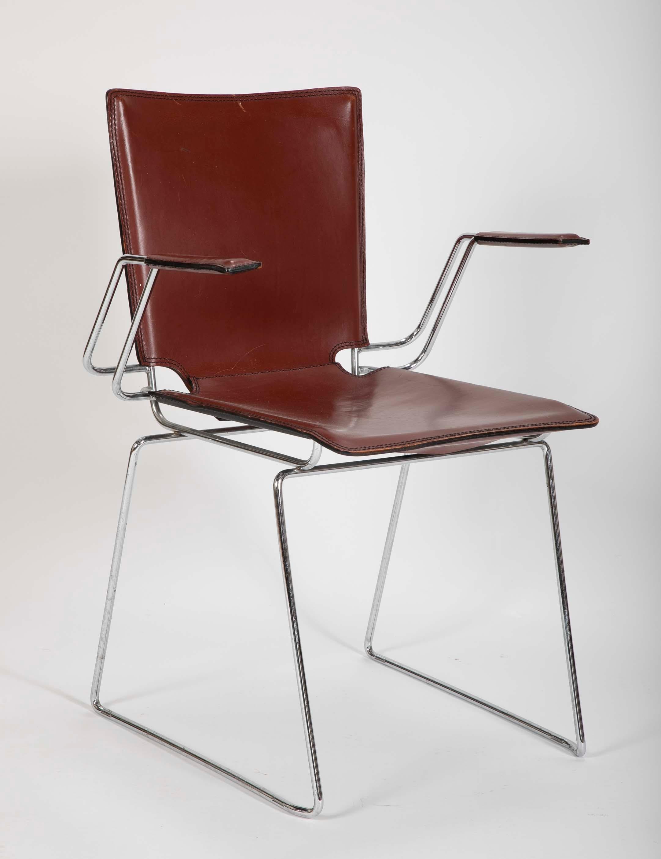 Pair of reddish brown leather and metal frame chairs. 20th Century. Most likely Italian.