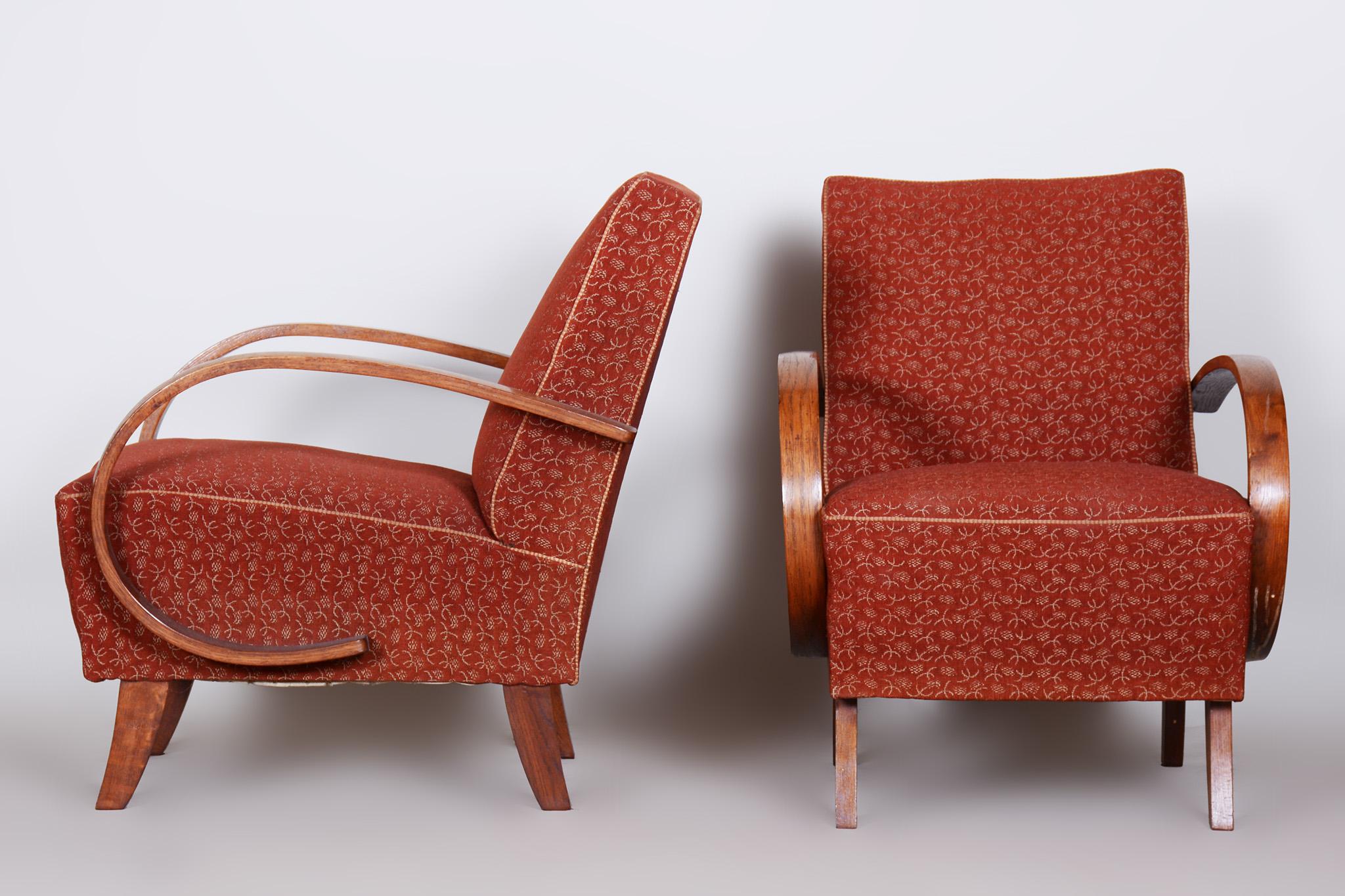 Pair of red Czech ArtDeco beech armchairs

Source: Czechia 
Period: 1930-1939
Architect: Jindrich Halabala 
Maker: UP Zavody 
Material: Beech, Fabric

Original preserved upholstery. The fabric has been professionally cleaned.

Designed by