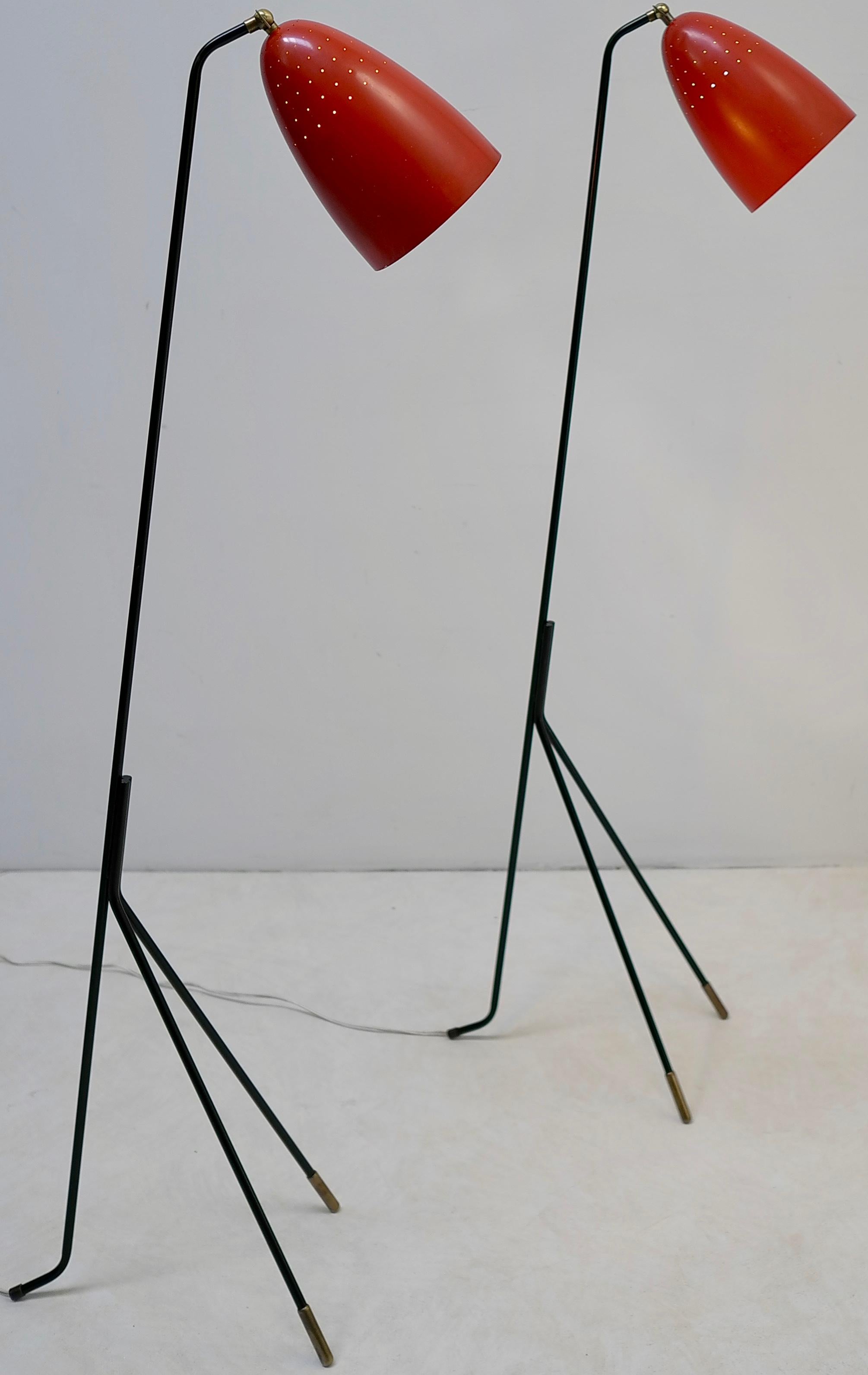 Red grasshopper floor lamp by Svend Aage Holm Sorensen, Denmark, 1950s. Beautiful light shines through the many tiny holes in the red hoods. The ends from the metal bases are made from brass.