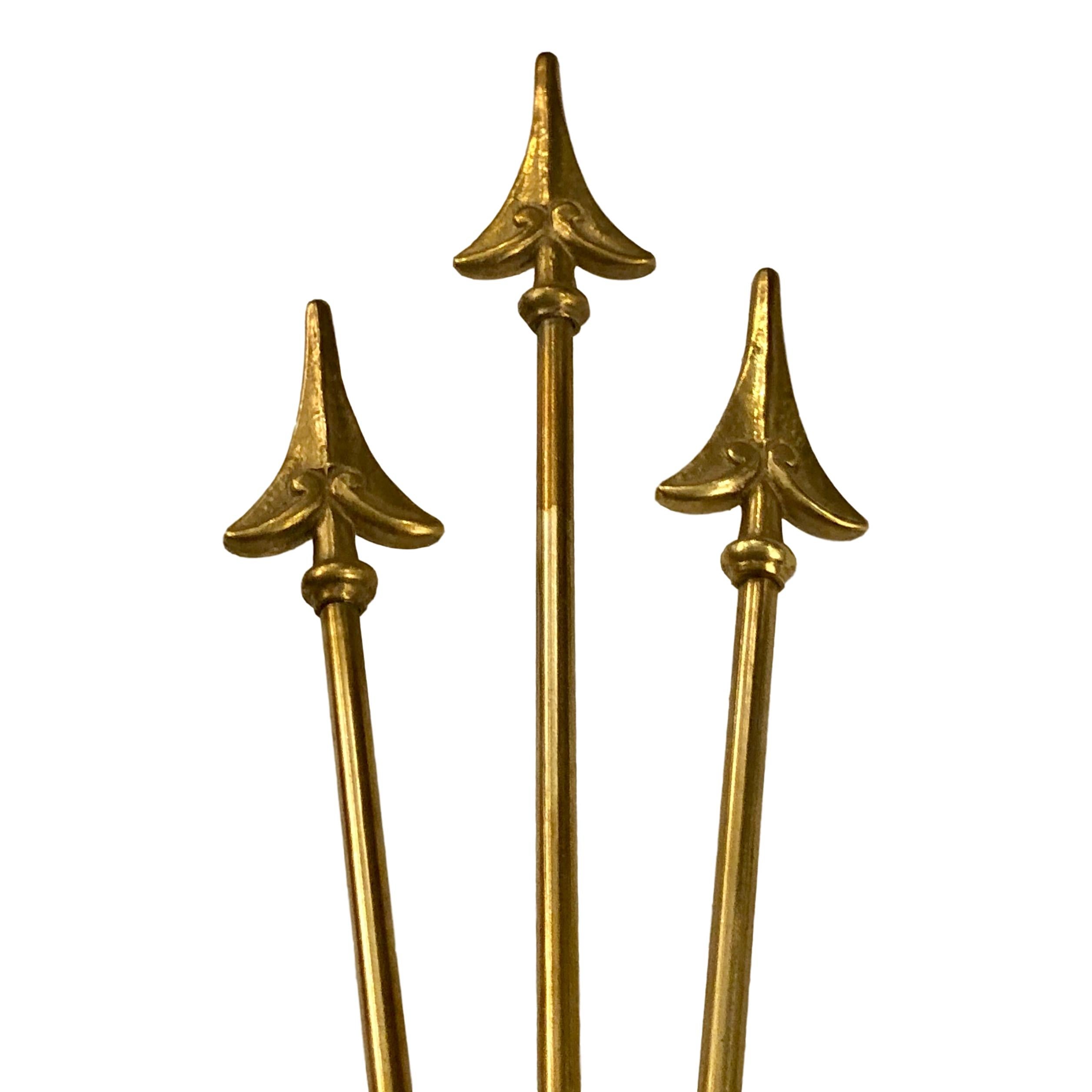 A pair of French circa 1940's painted and gilt metal Empire-style sconces with interior lights.

Measurements:
Height: 15