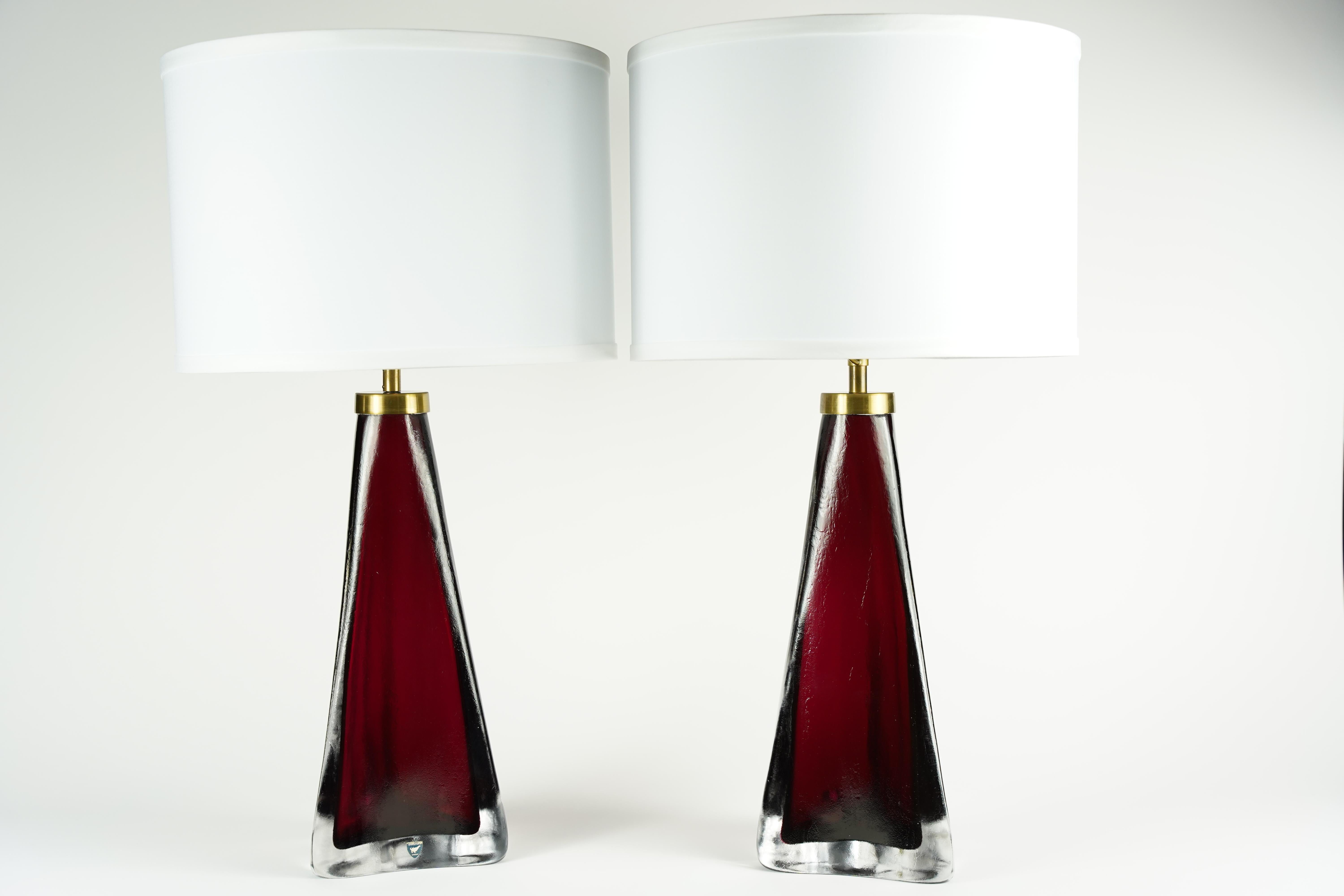 Pair of red frosted triangular Orrefors lamps, Sweden, 1960 encased in a layer of clear glass with brass fittings, By Carl Fagerlund for Orrefors.

Rewired for the US.
Shades not included.