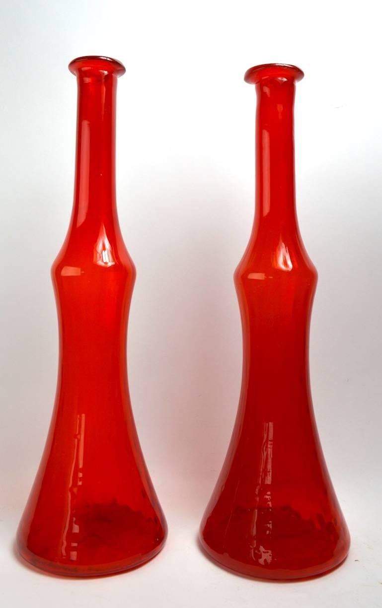 Unusual to find a matching pair of tall vases, these are attributed to Carl Erickson, both are in excellent original condition, clean and ready to use. Priced and offered as a pair. Classic midcentury American decorative items, chic, sophisticated
