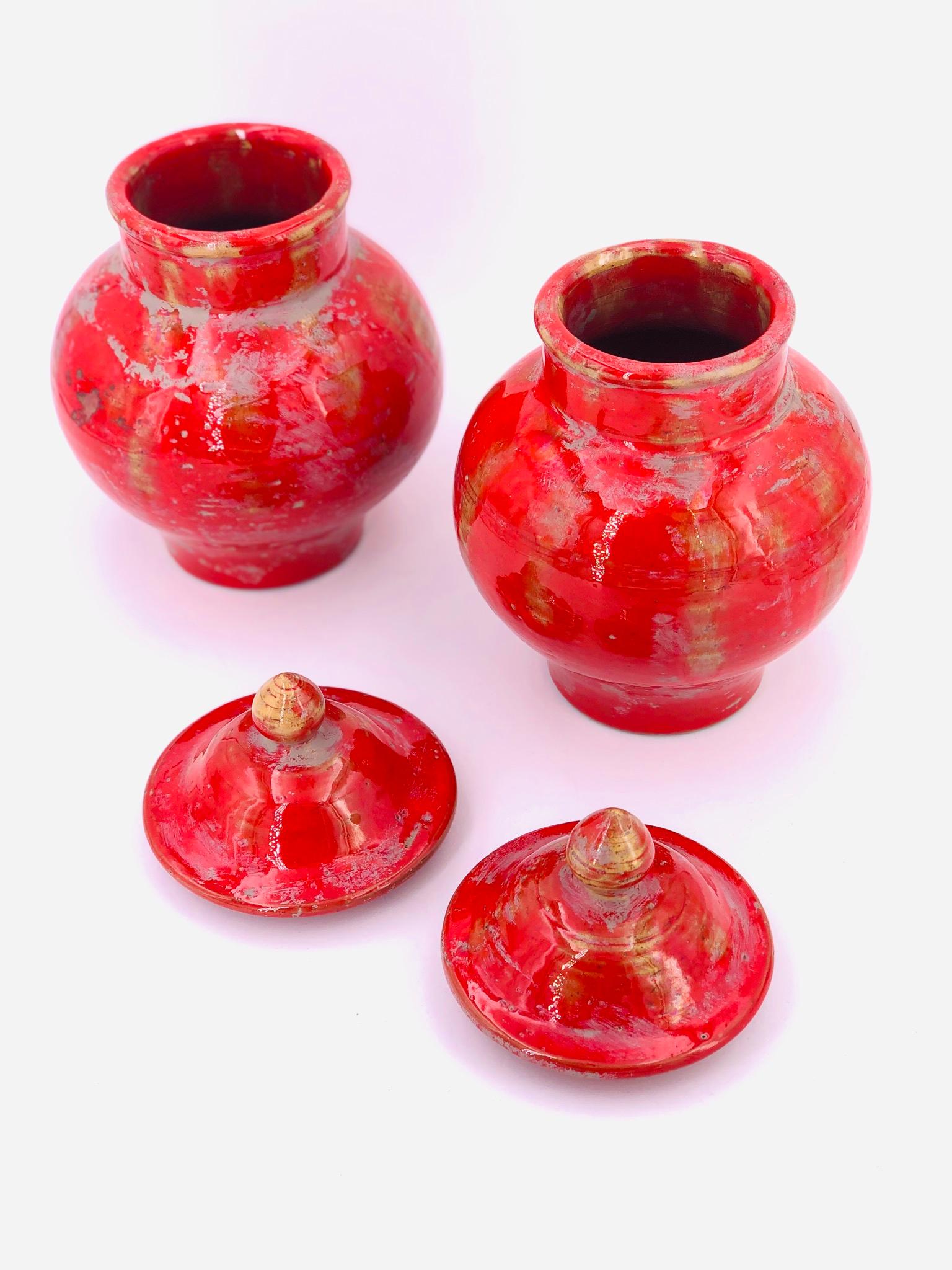 Beautiful pair of ceramic red glazed Decorative jars with lids, circa 1950s made in Italy stamped and initial, great condition.
