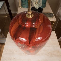 Pair of Red Glazed Pottery Lamps with Brass Details