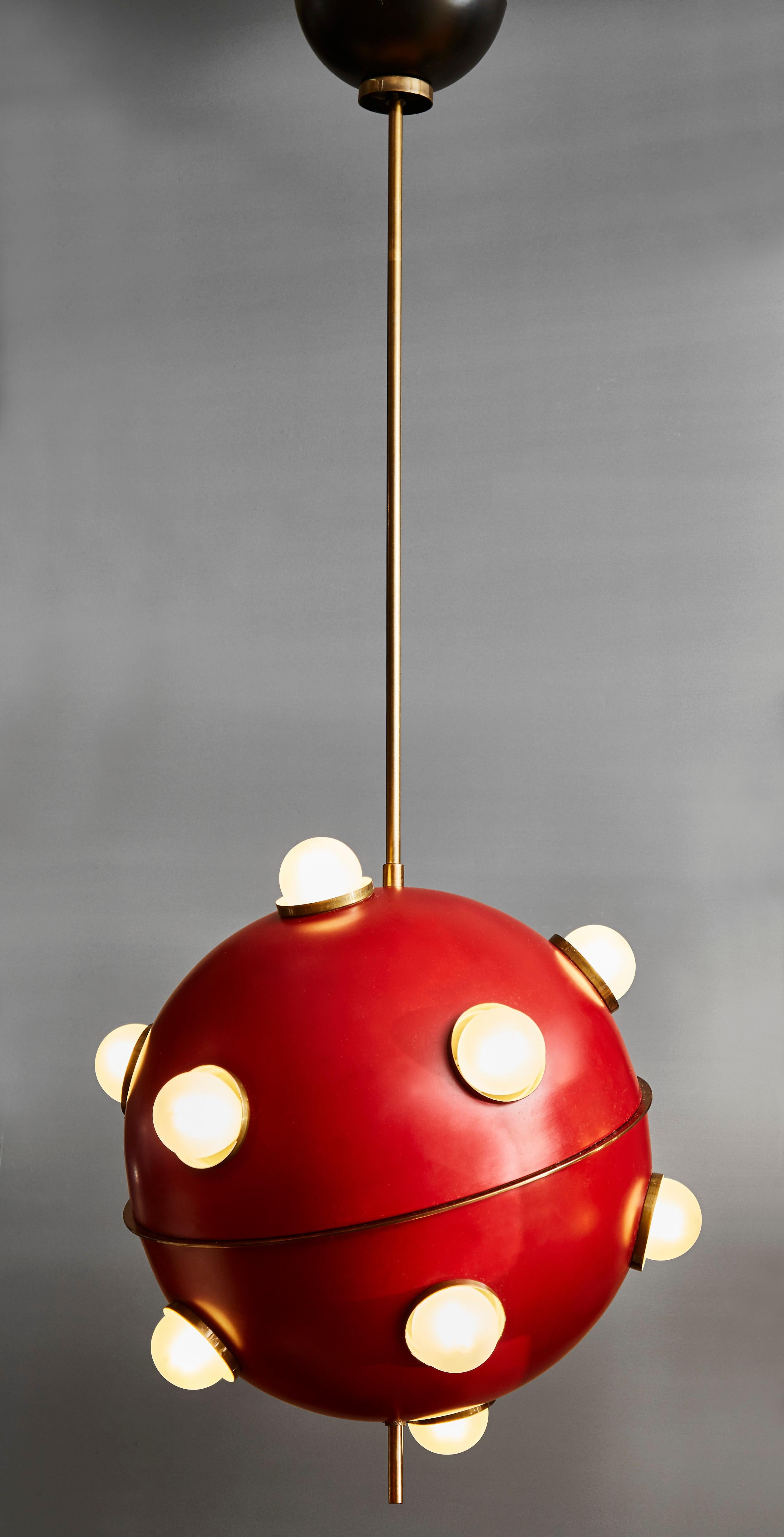 Pair of suspensions made of enameled brass with twelve lights designed by Oscar Torlasco for Lumi in the 1960s.