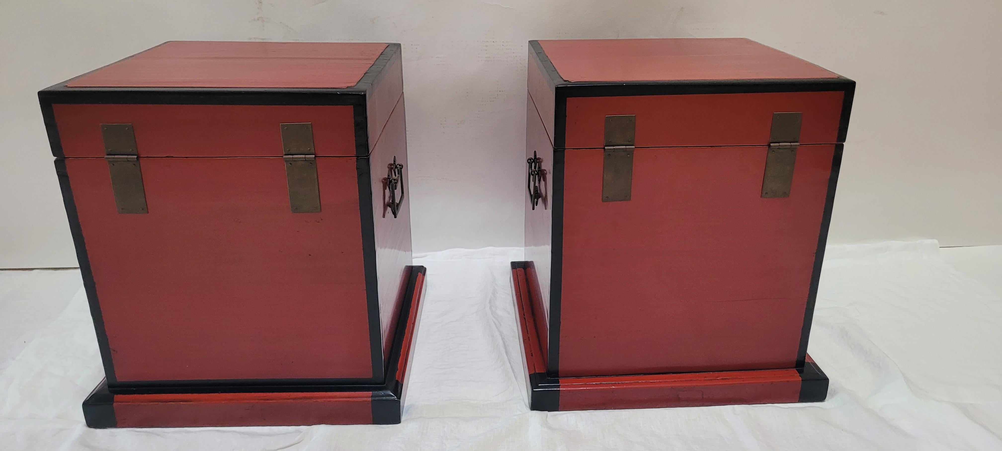 Pair of Red Lacquer Boxes	
These square trunks have a base and are decorated with square metal hardware on the front.  They would have been part of a lady’s dowry and are therefore lacquered in the color red which signifies luck, double happiness