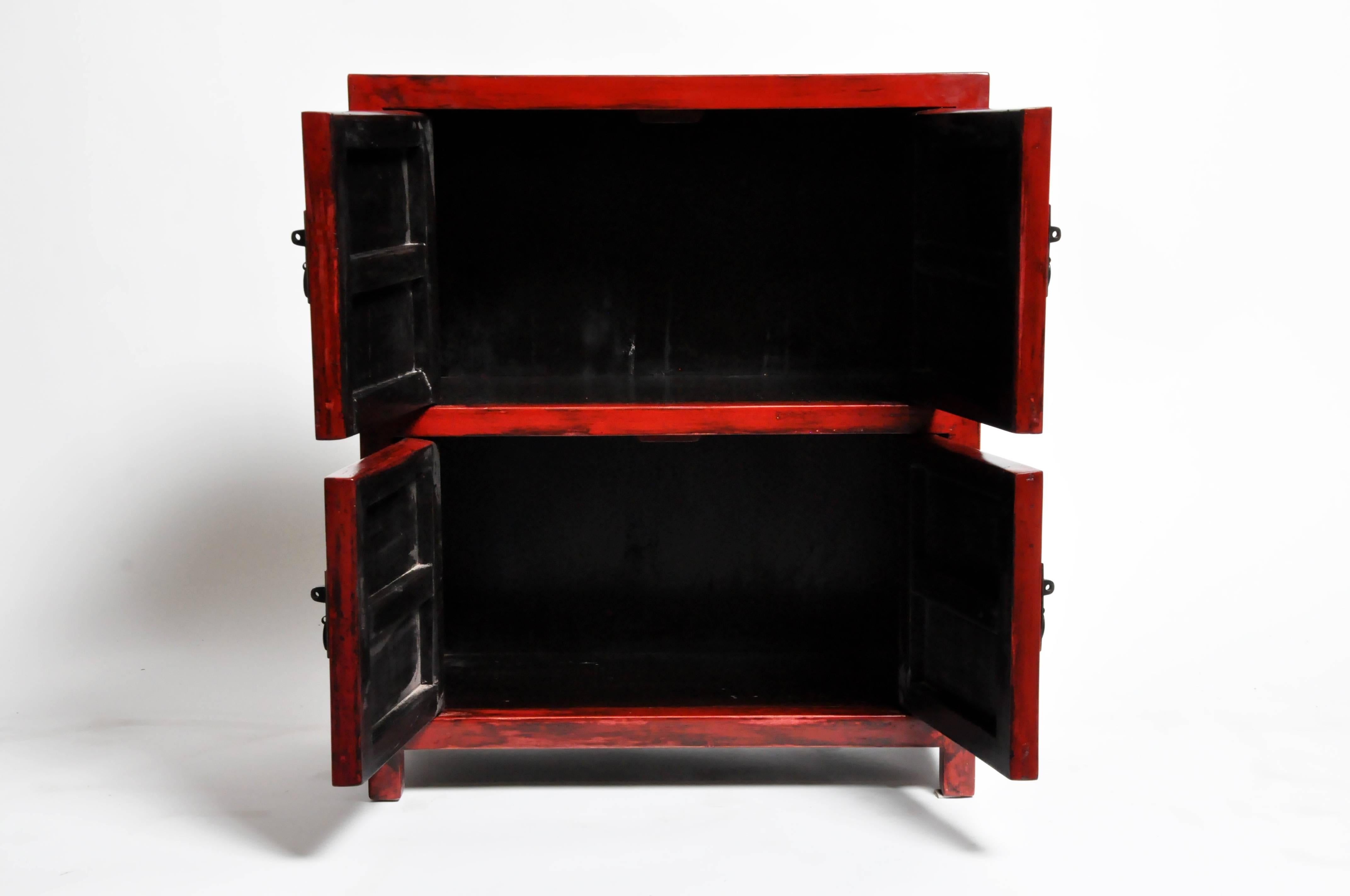 Add a pop of red to any room with this pair of red lacquered side chests from Jiangsu, China. Made from reclaimed elmwood and lacquer the pair features mortise and tenon joinery, and two shelf each. You can also customize a new one and make it your
