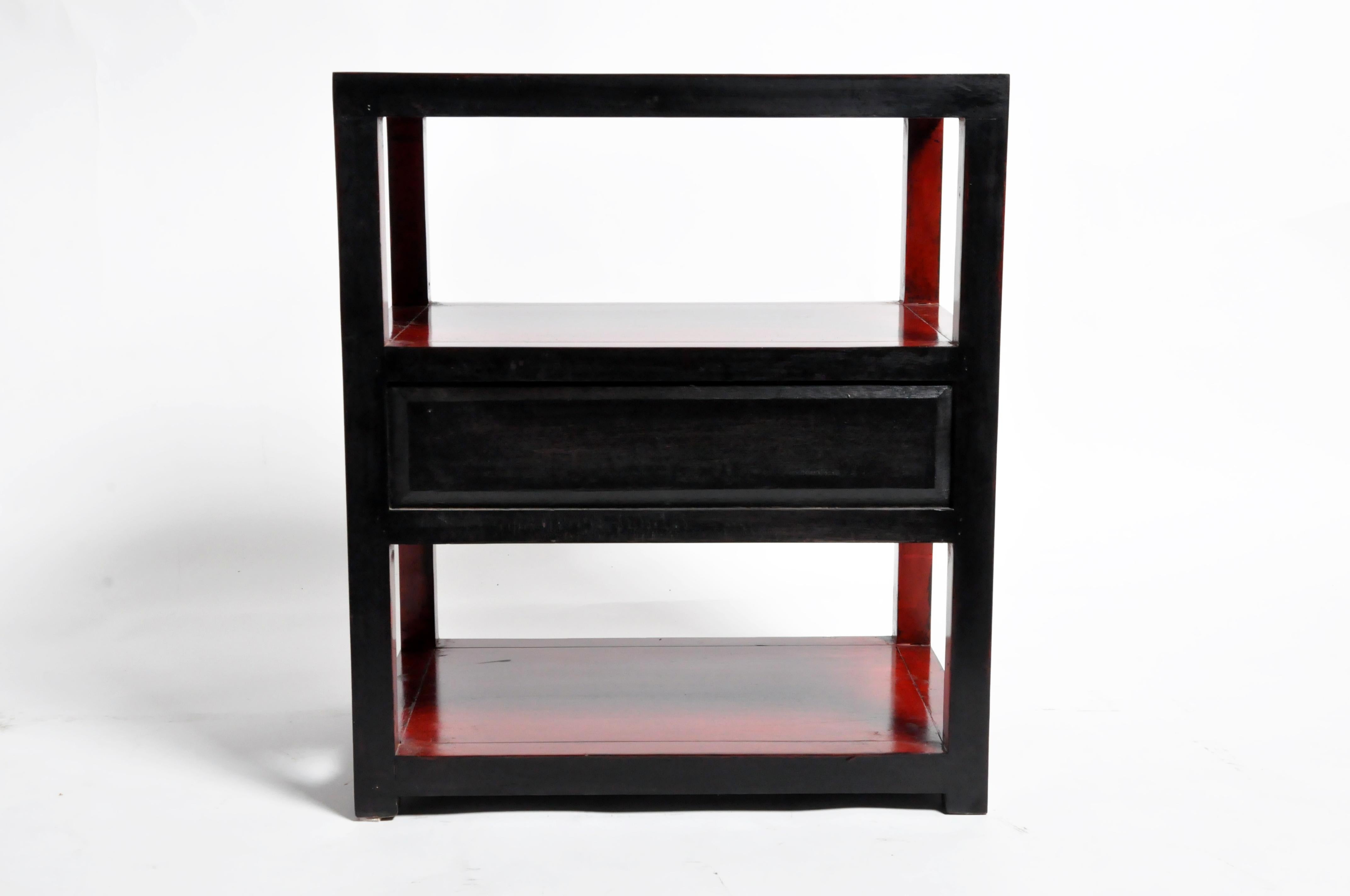 These handsome pair of side tables are from China and were made from elmwood. They both feature a red lacquered finish with display shelves and a drawer for storage. You can also customize a brand new one and make it your own. Wood, color, finish,