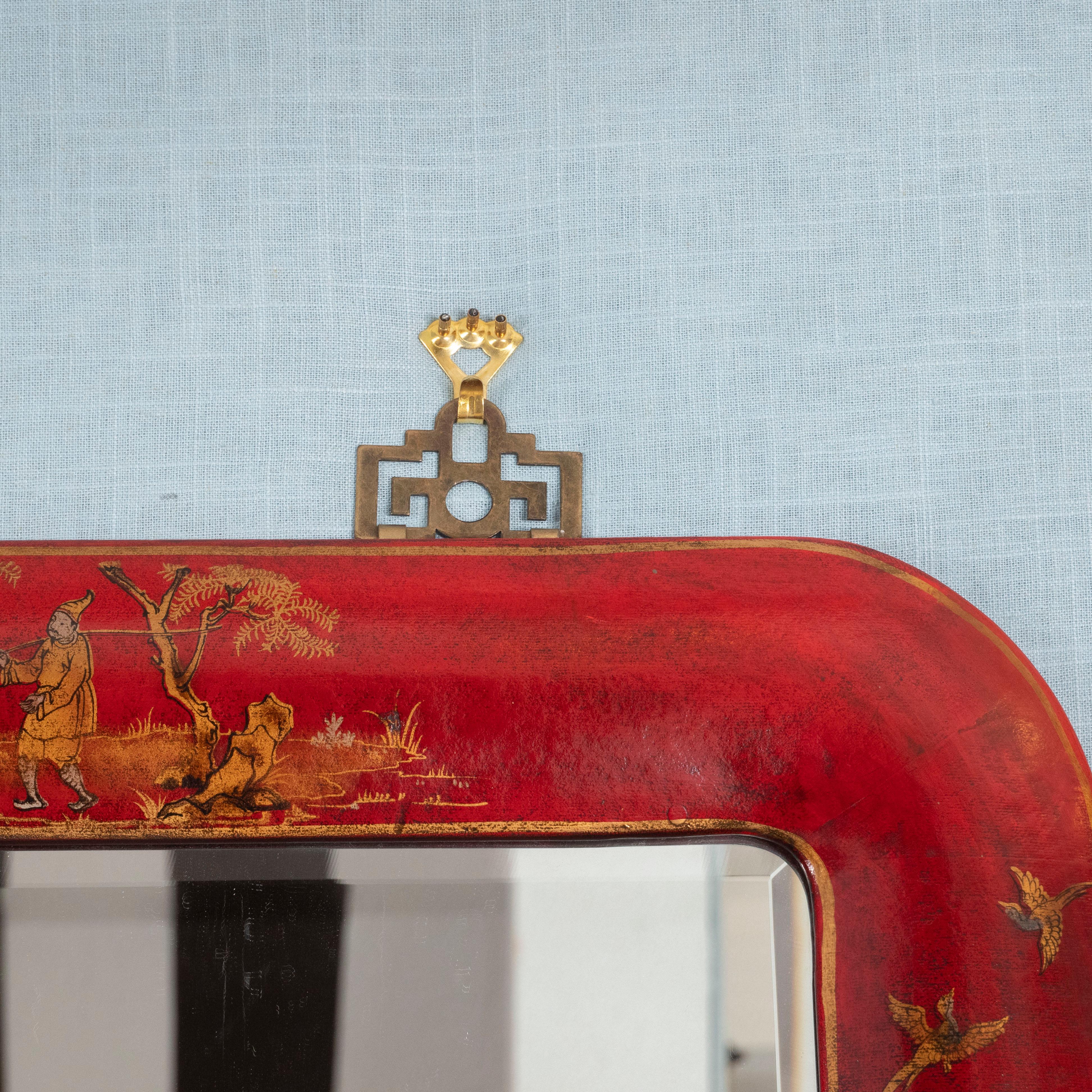 We love pairs of mirrors, and these two stand out among the rest! Lacquered in a deep red with gold accents in a chinoiserie motif. The mirrors feature unique brass hanging brackets as well. A great way to add color, character and personality to a