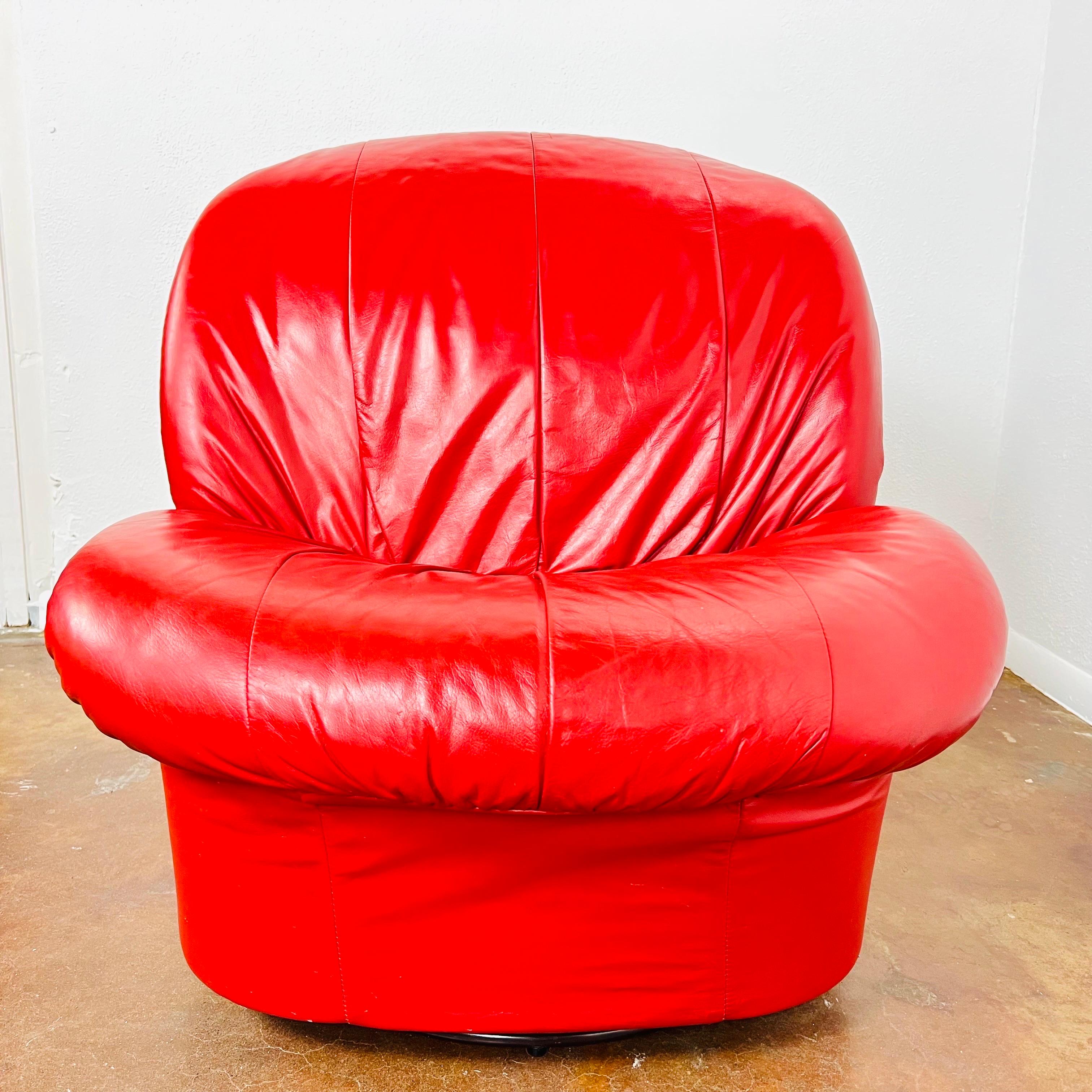 Pair 1980s postmodern leather clamshell lounge chairs in the style of Vladimir Kagan. Full grain leather upholstery with swivel and gliding bases.