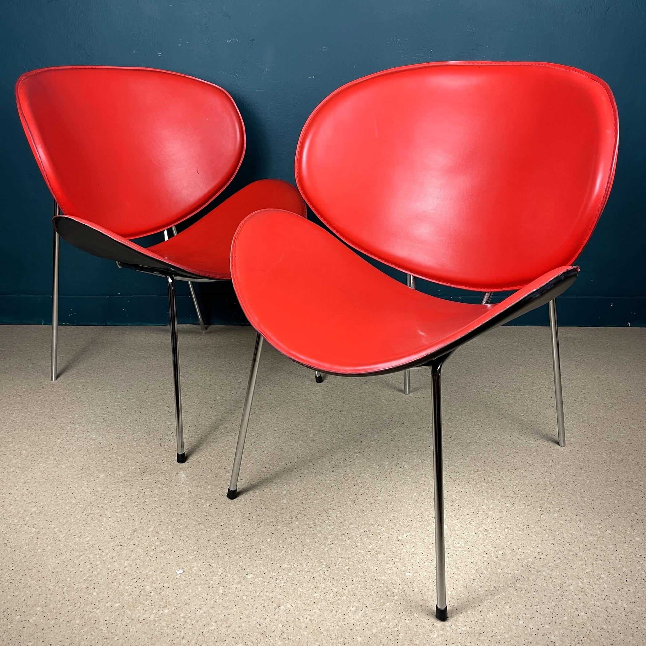Infuse a pop of vibrant red into your living space with this captivating pair of chairs, drawing inspiration from Pierre Paulin's iconic 1960s design, the Orange Slice Chair.

Featuring a striking orange slice-shaped seat perched atop a sturdy