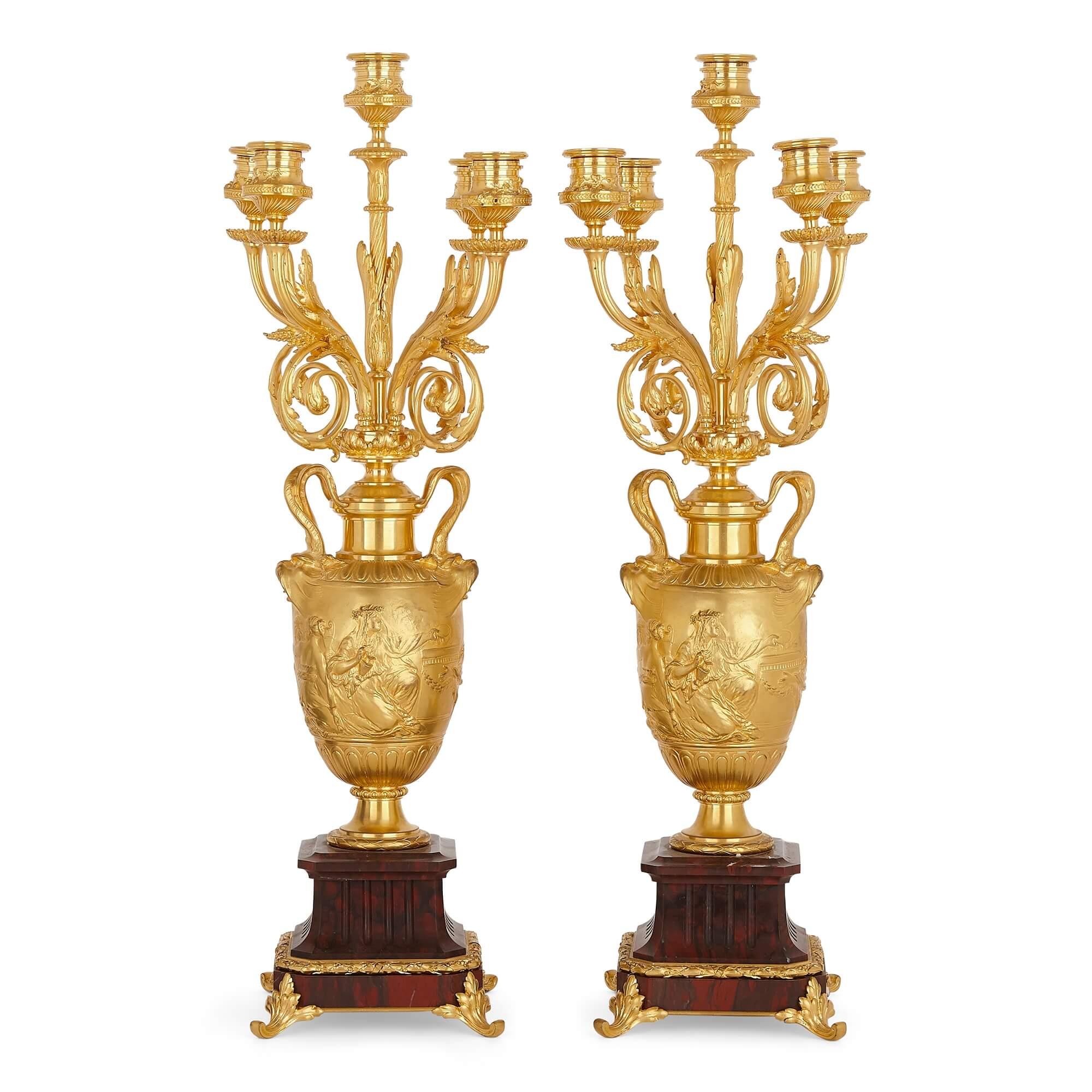 Pair of red marble and gilt bronze table candelabra by Barbedienne
French, 19th Century
Height 57cm, width 17cm, depth 15cm

The exceptional candelabra in this pair, by the famed maker Barbedienne, are crafted from red marble and gilt bronze in the