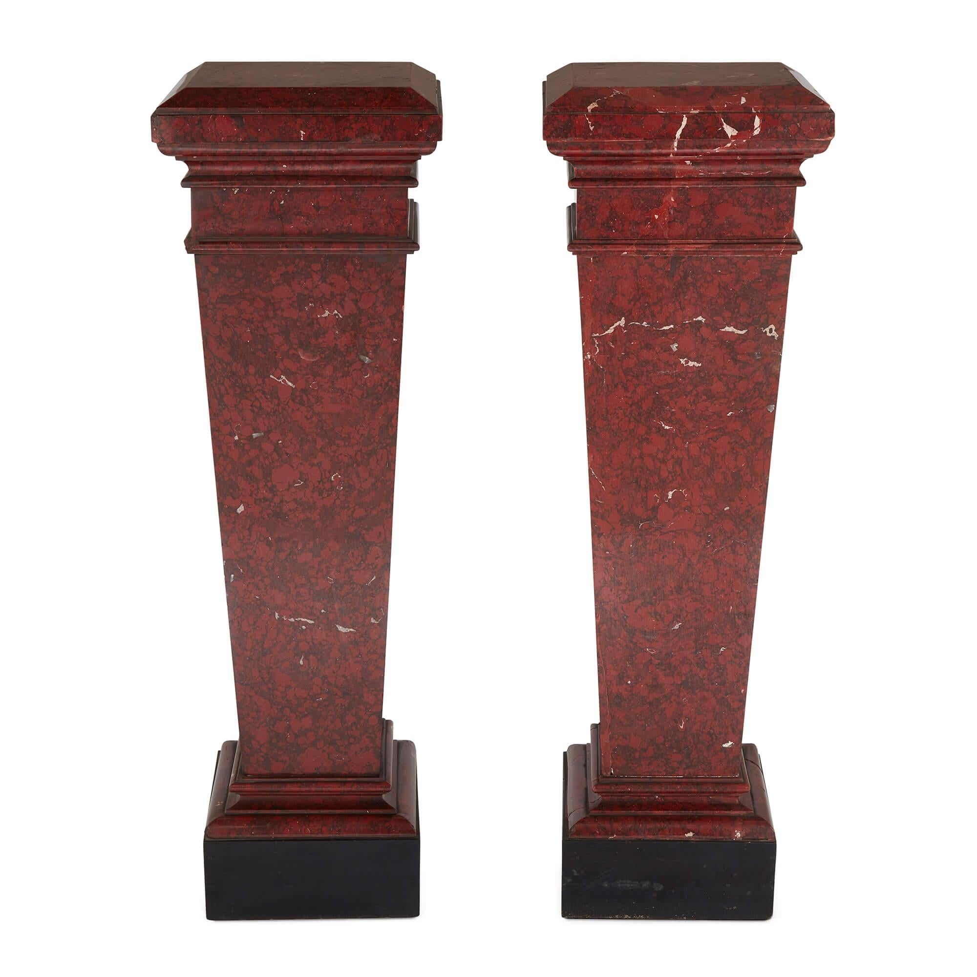 Pair of red marble pedestals in the Neoclassical style
French, 19th Century 
Height 108cm, width 33cm, depth 33cm

Crafted in France during the 19th century, this refined pair of pedestals are ideal for the display of precious objects or works of