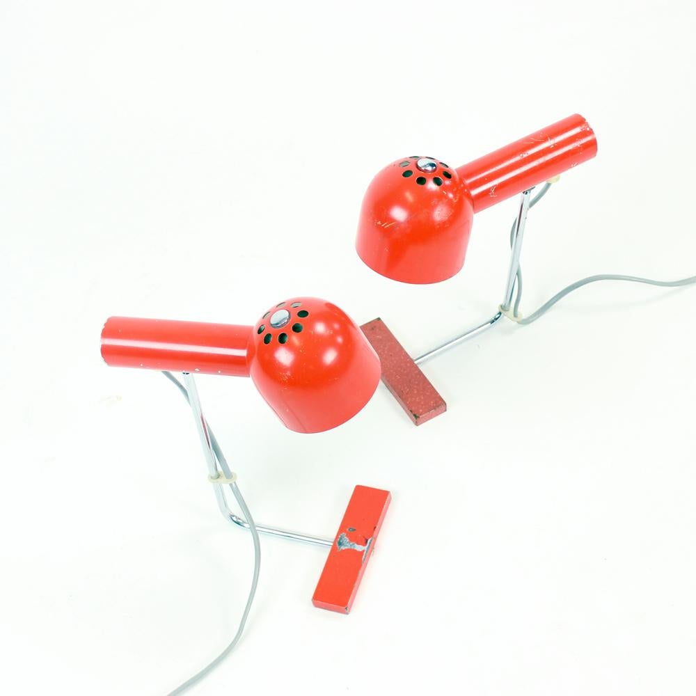 Industrial looking table lamps designed by Josef Hurka for Napako company in Czechoslovakia in 1960s. The set is made of two lamps in same design. Made of metal with red shields and bottom parts. The construction is made of chrome. The lamp is