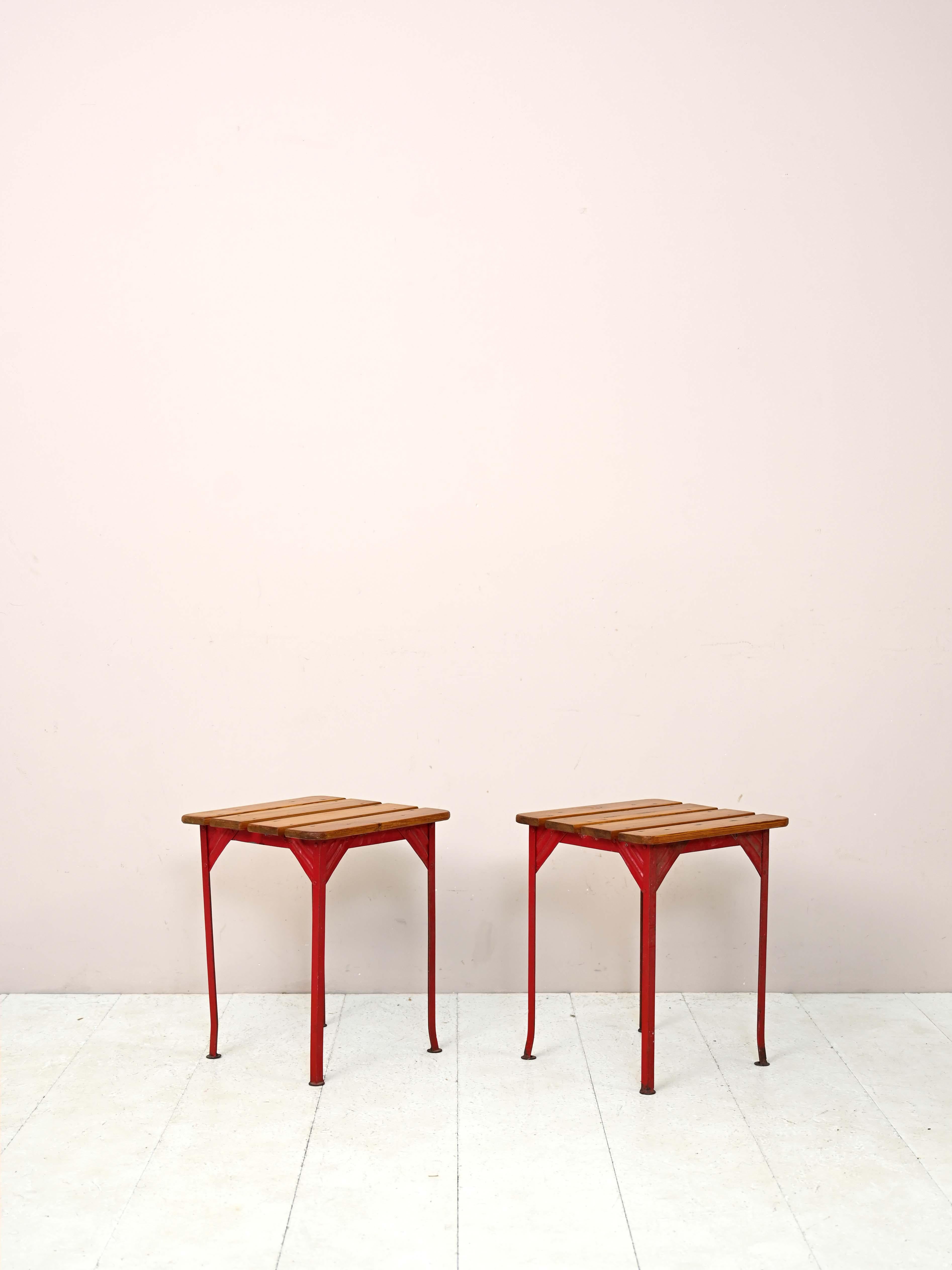 Scandinavian vintage stools.

Pair of industrial style stools with red-painted metal frame and wooden slat seat.
Also try them as side tables or as nightstands for eclectic style furniture. 

Good condition. Conservative restoration with natural