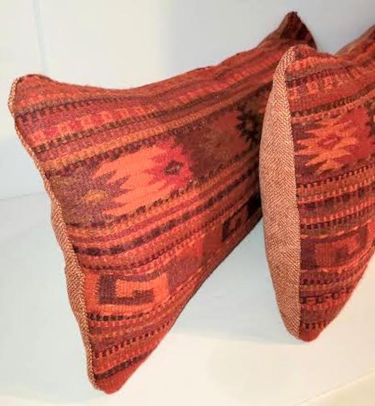 Pair of custom made red Mexican Indian weaving pillows. Zippered casing. Featherand Down Insert.