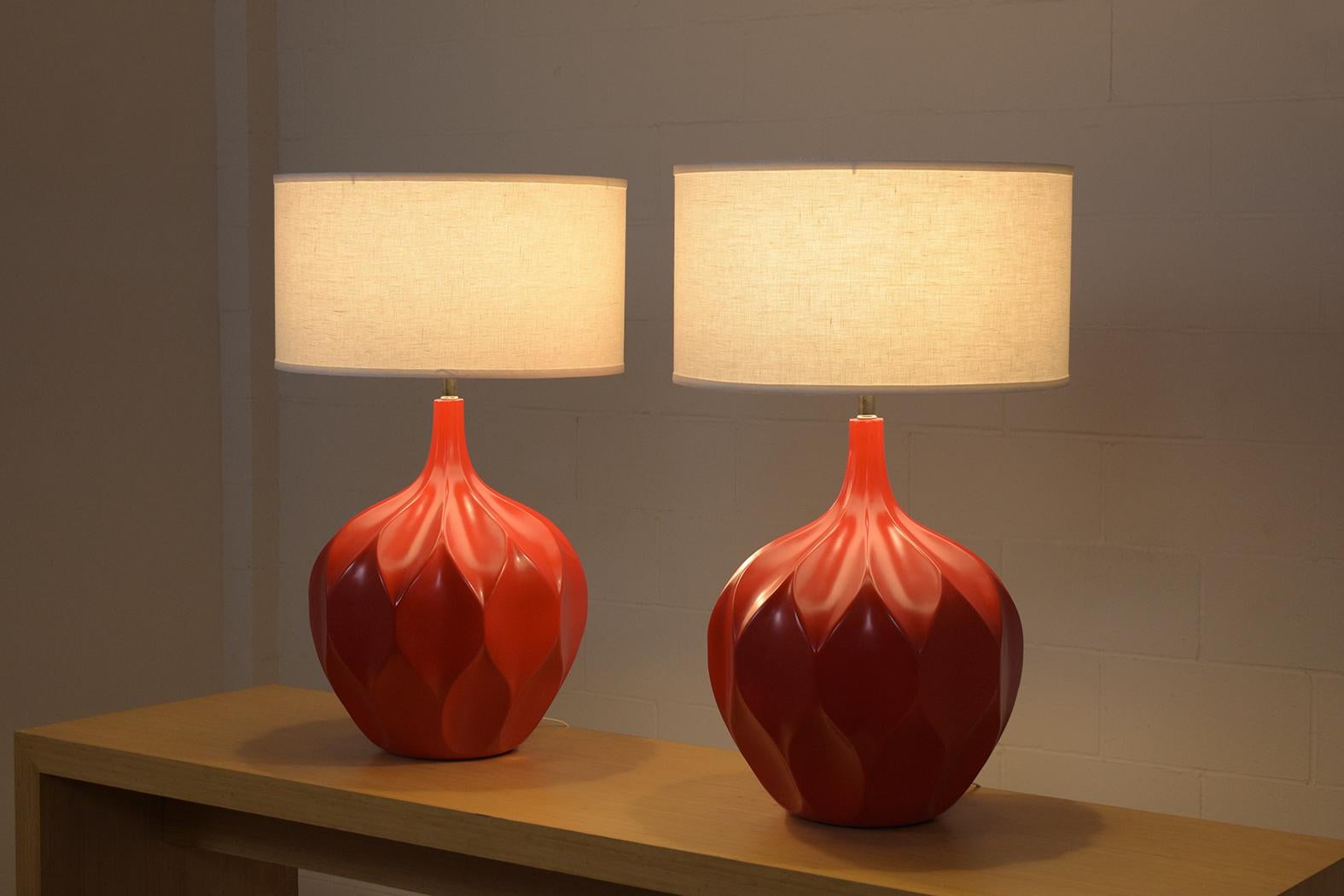 Elevate your space with our handcrafted vintage table lamps from the 1960s. These ceramic beauties, brought back to life by our skilled in-house team, are the epitome of mid-century modern elegance. In great condition, their sphere shape boasts a