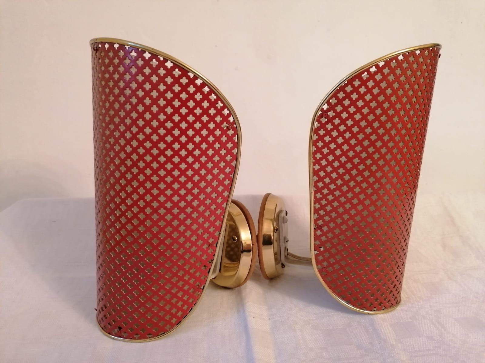 Brass construction with steel performed red lacquered shades each fitted with one E27 Socket. Made in Austria in the 1950s and attributed to Rupert Nikoll as manufacturer.