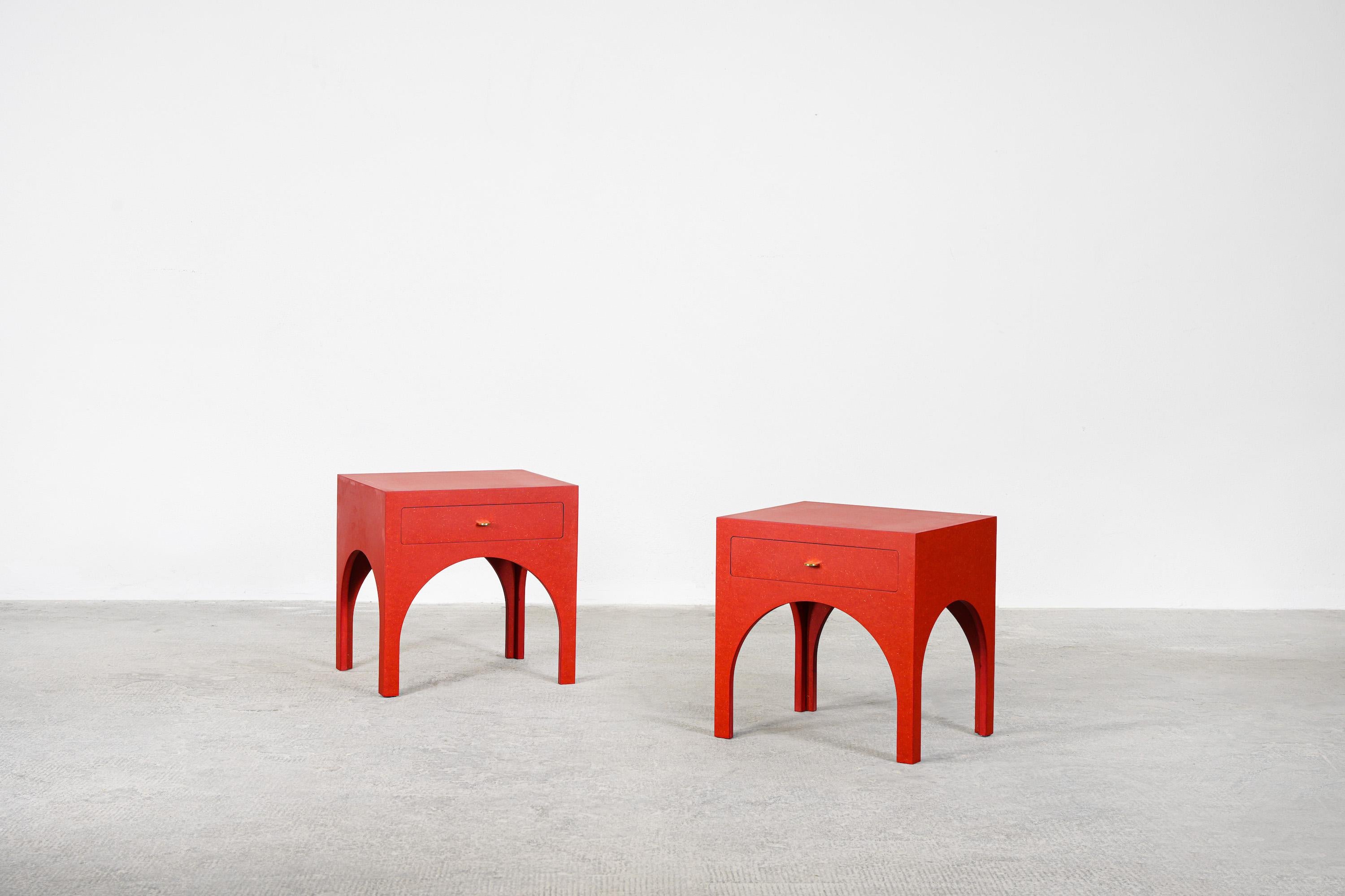 A beautiful pair of red side tables/nightstands designed by Yuzo Bachmann for Atelier Bachmann, handcrafted in Germany, 2019.
These nightstands are made out of red valchromat and polished brass handles. Finished with natural furniture