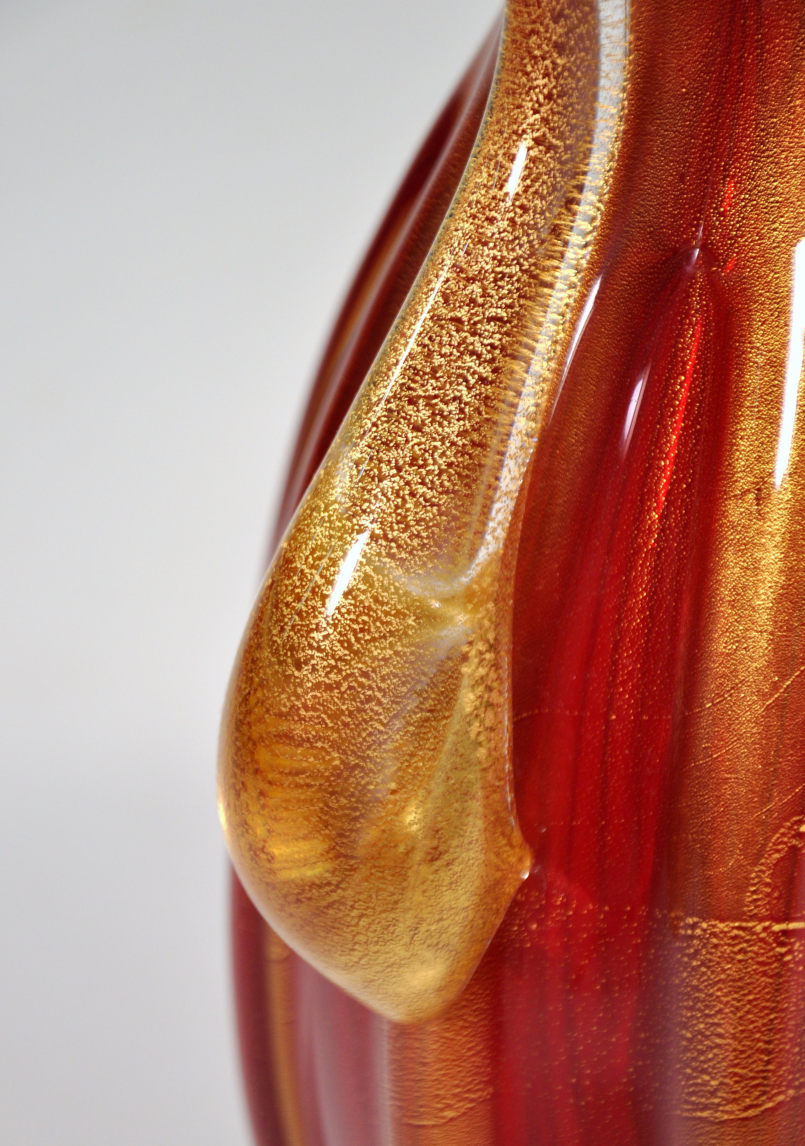 Impressive large pair of heavy red and gold aventurine vases by Italian art glass master Pino Signoretto. Signed on underside.
 