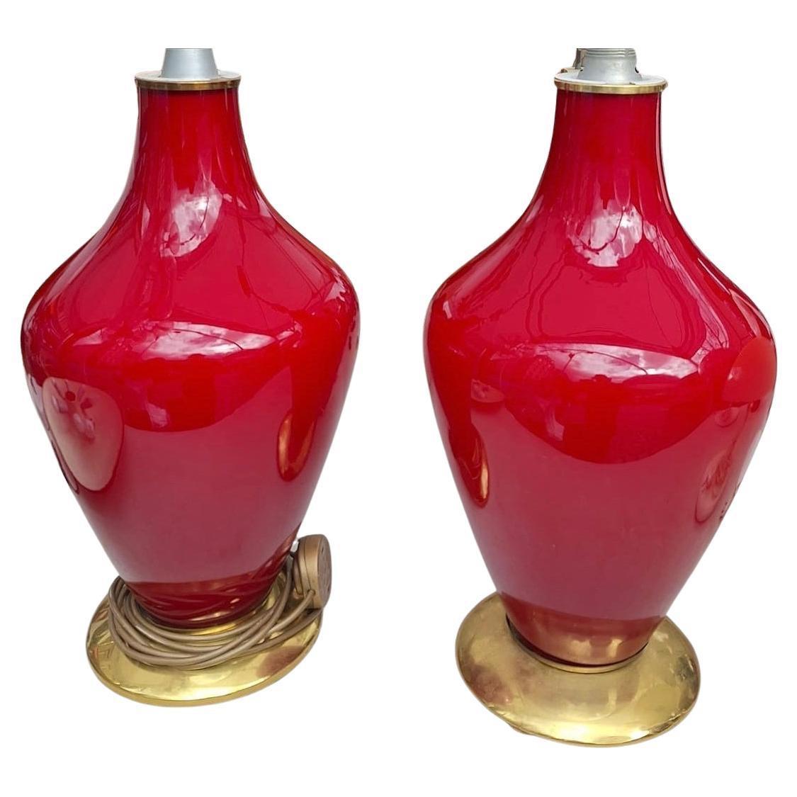 Pair of circa 1970's Italian red opaline table, floor lamps with gold tone bases.  

Measurements: 
Height of glass body: 21.2