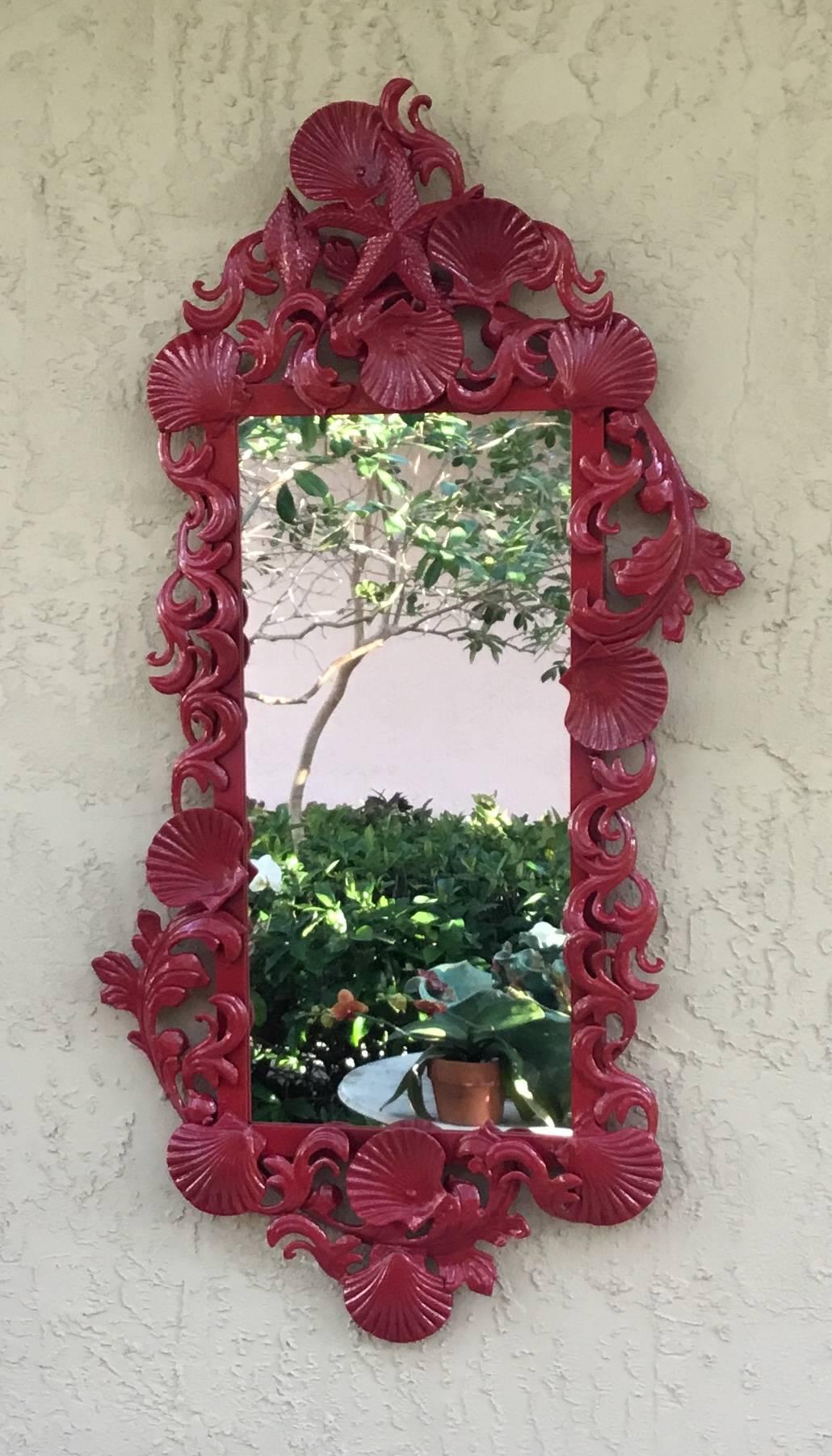 Exceptional pair of mirrors made of iron, artistically decorated with seashell and sea star motifs, painted with vibrant red lacquer color.
Will sell single mirror upon request.
Actual mirror size: 22”.5 x 10”25.