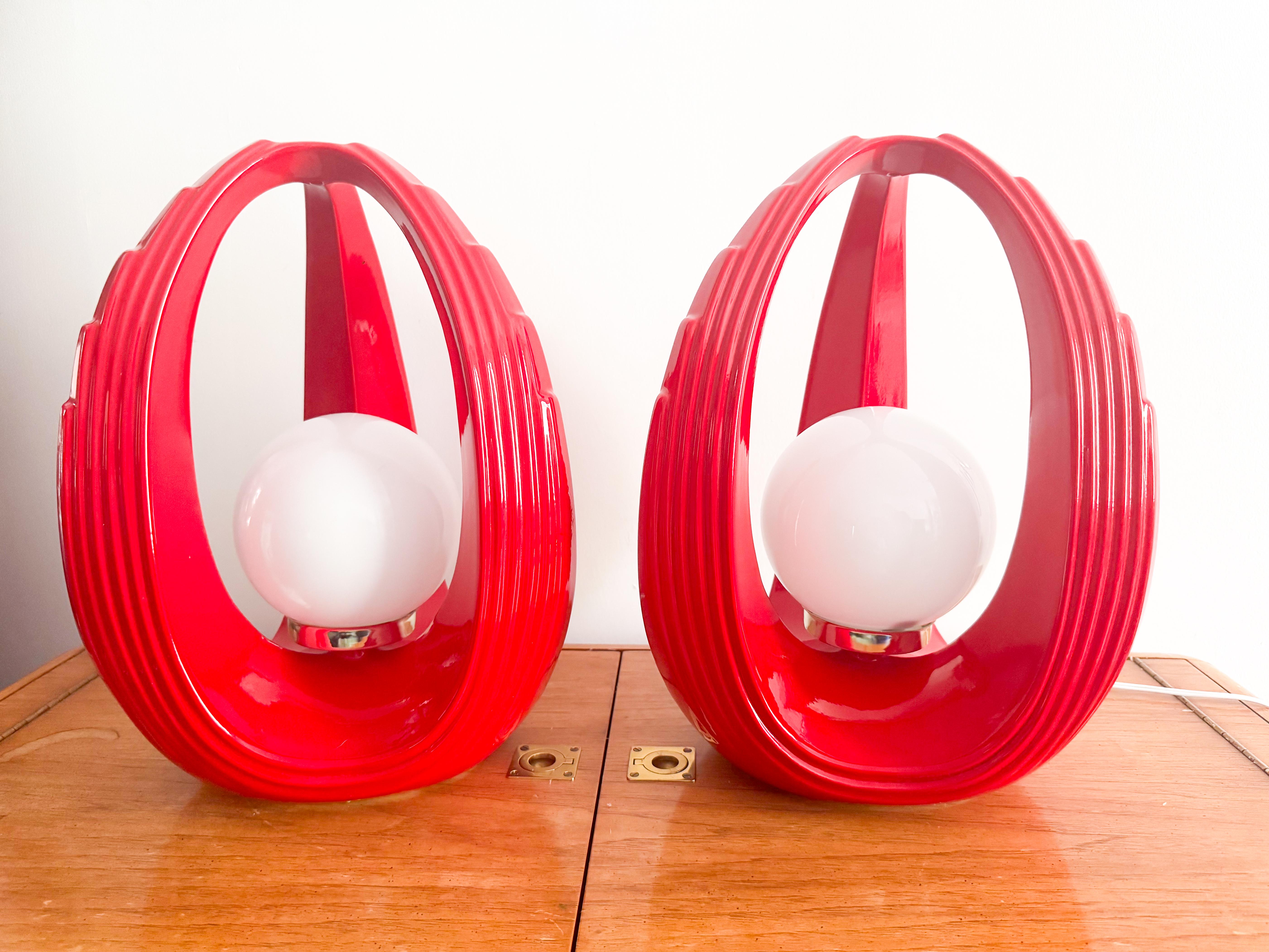 Space Age sculptural table lamps handcrafted in Canada circa 1980s, featuring their original glazed red finish—a rare and sought-after version that highlights their bold, futuristic design. Each lamp showcases a striking U-shaped silhouette with
