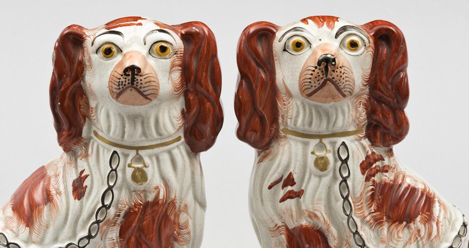 Pair of red Staffordshire dogs with pink noses, gilded collar and locket, black chain, the number “3” on bottom denoting the model size. These dogs usually came in six sizes.