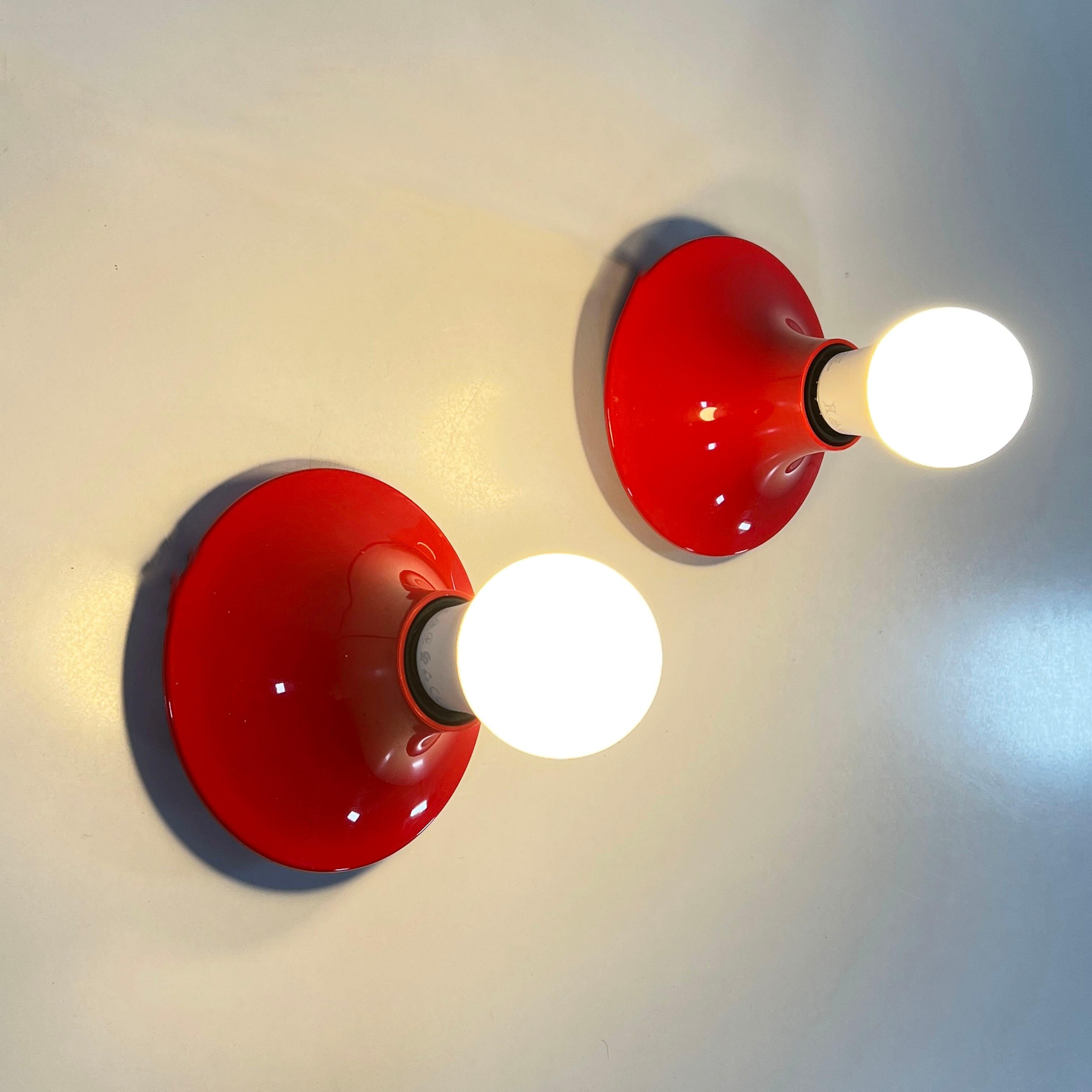 Designer - Vico Magistretti
Producer - Artemide
Model - “Teti” Wall Lamp 
Design Period - Sixties
Measurements - Width 7 cm x Depth 7 cm x Height 14 cm
Materials - Plastic
Color - Red
??????Condition - Good 
Comments - Light wear consistent