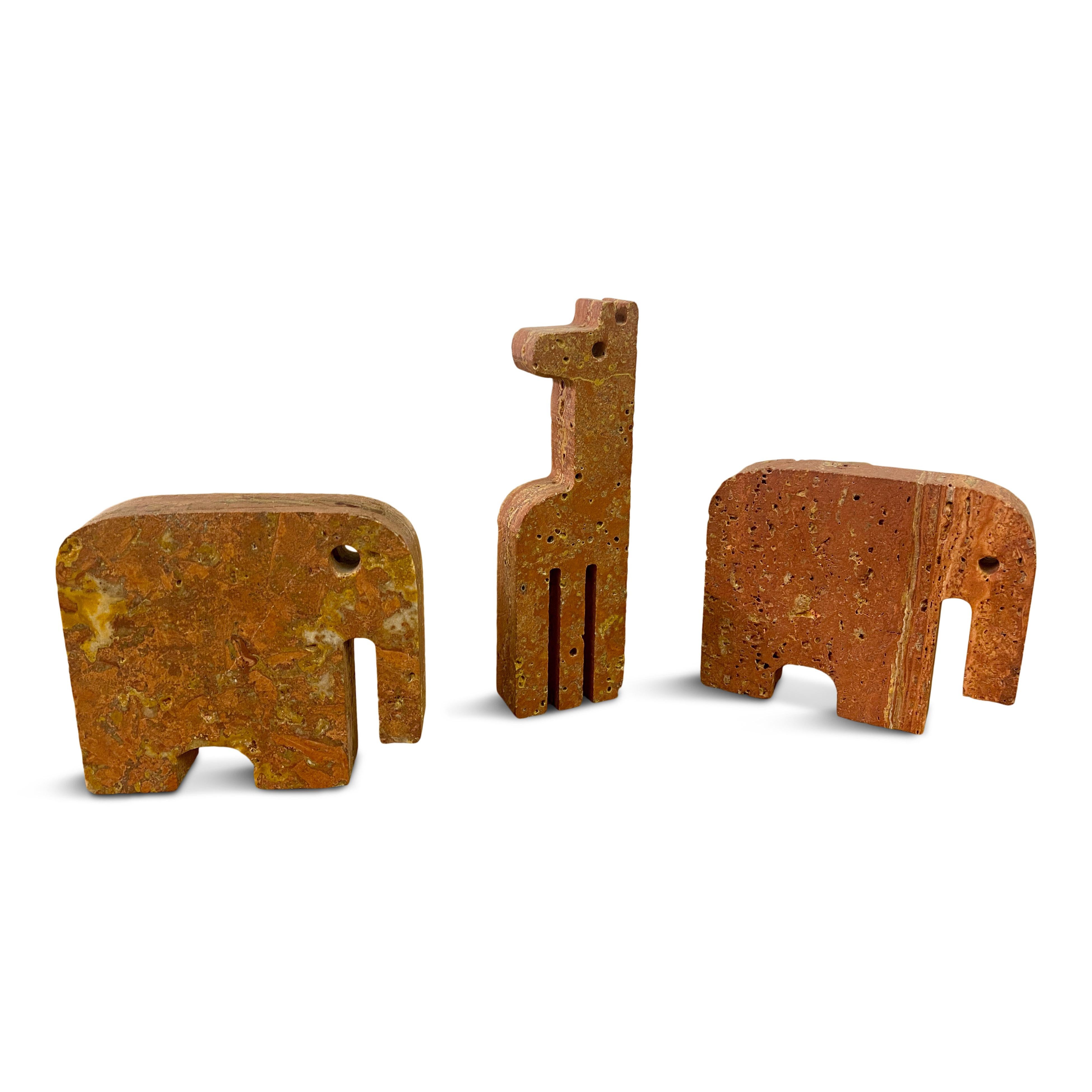 Set of three bookends

Made from red travertine

One giraffe and a pair of elephants

By Fratelli Mannelli

Giraffe measures 13 x 4 x 2

Italy 1970s/1980s
