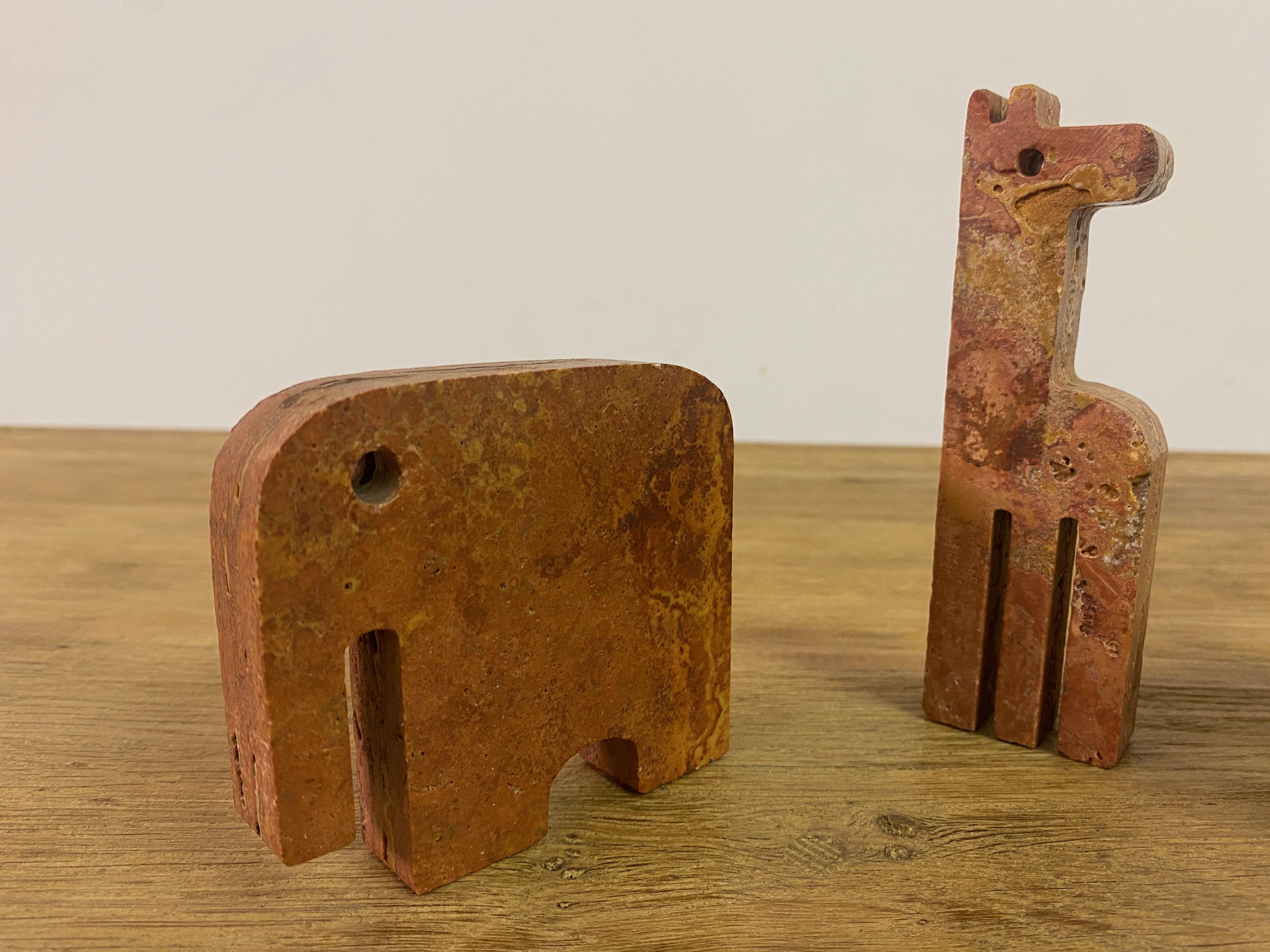 Pair Of Red Travertine Elephant Bookends And A Giraffe For Sale 3