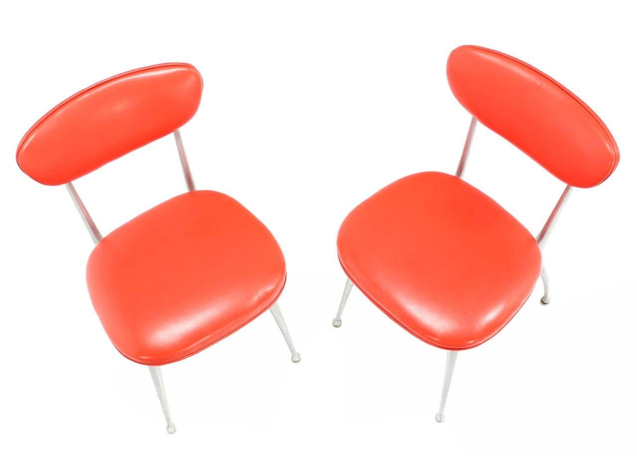 American Pair of Red Vinyl Upholstery Cast Aluminum Sculptural Chairs