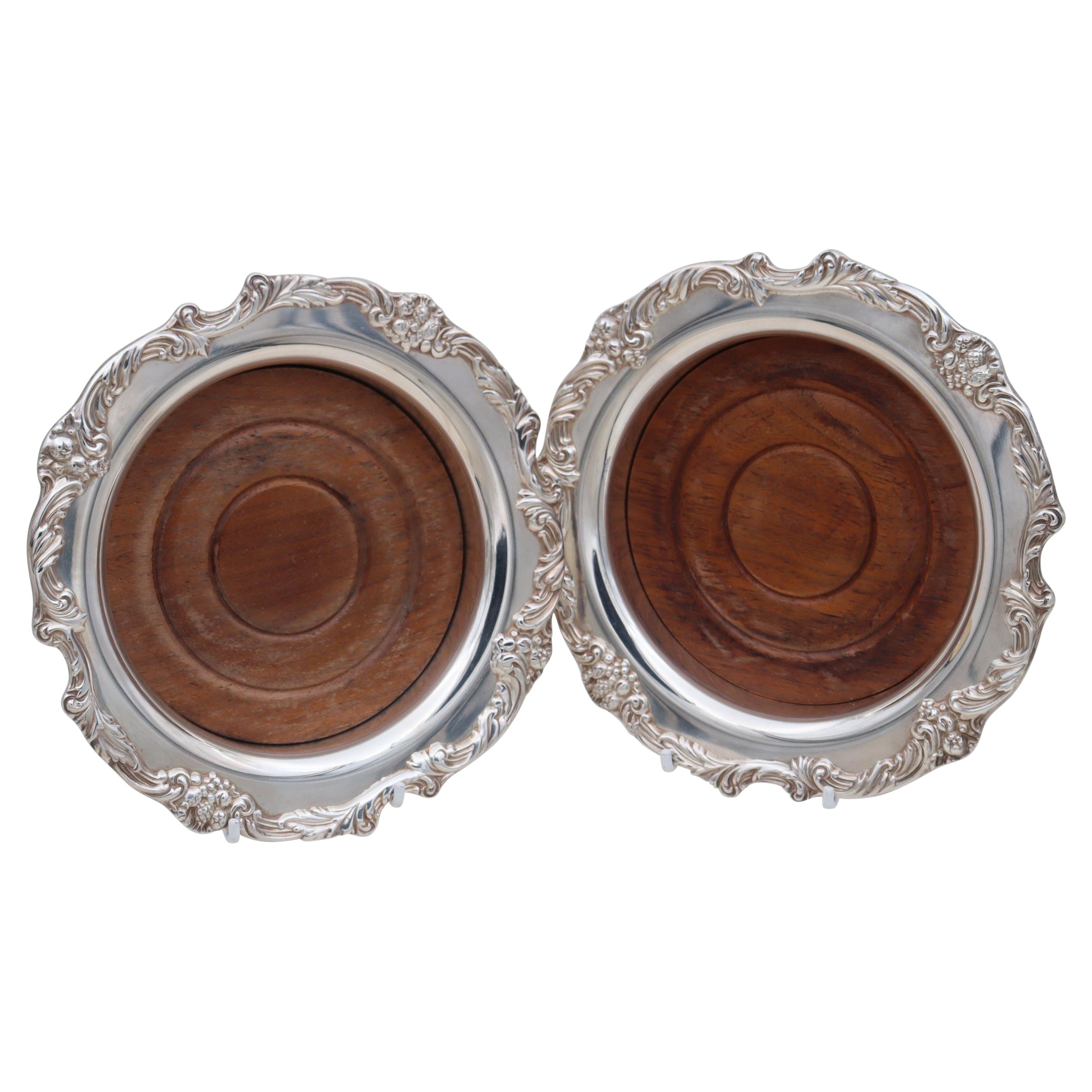 Pair of Reed and Barton silver plated wine bottle coasters