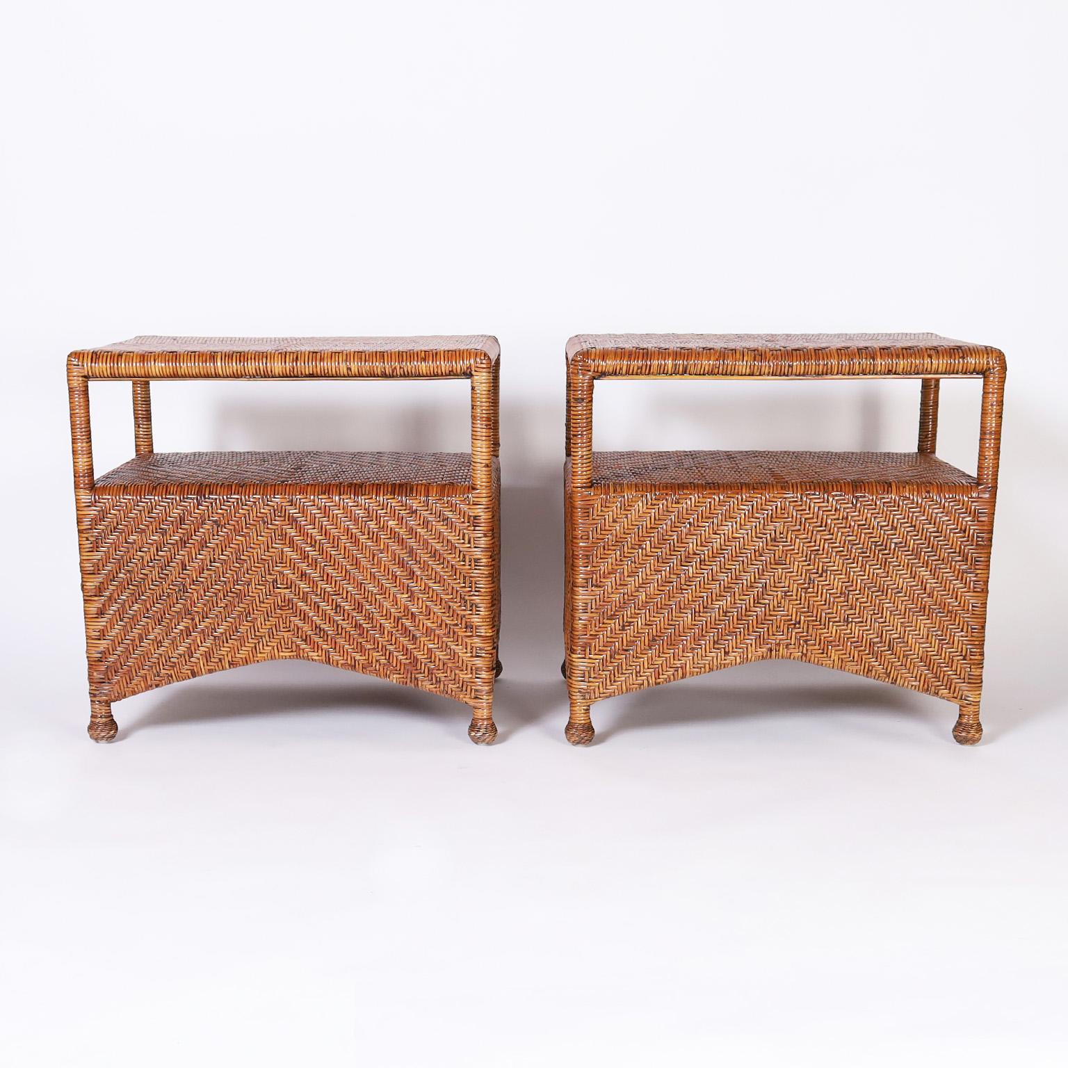 Mid century stands or tables with herringbone pattern reed wrapped around a wood frame having two tiers.