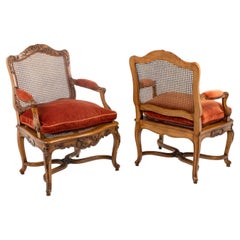 Pair of Regence style armchairs in beech and cane. Twentieth century. 