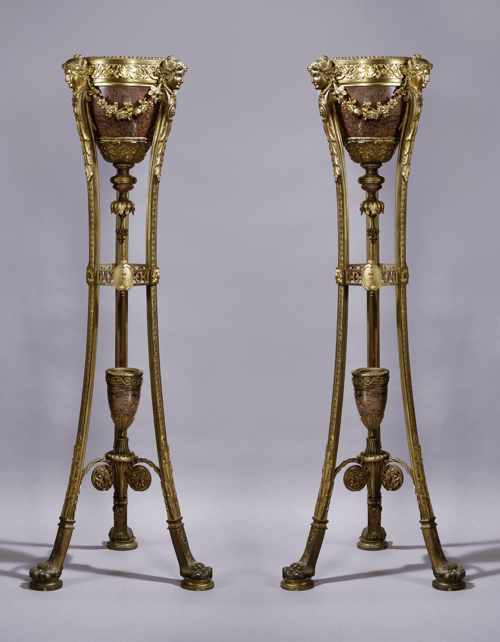 A very fine pair of Regence style gilt bronze and Rouge Griotte marble jardinières on stands. 

French, circa 1870.

Each jardinière has a scrolling foliate frieze above a tapering rouge Griotte marble urn with acanthus cast lower section, with