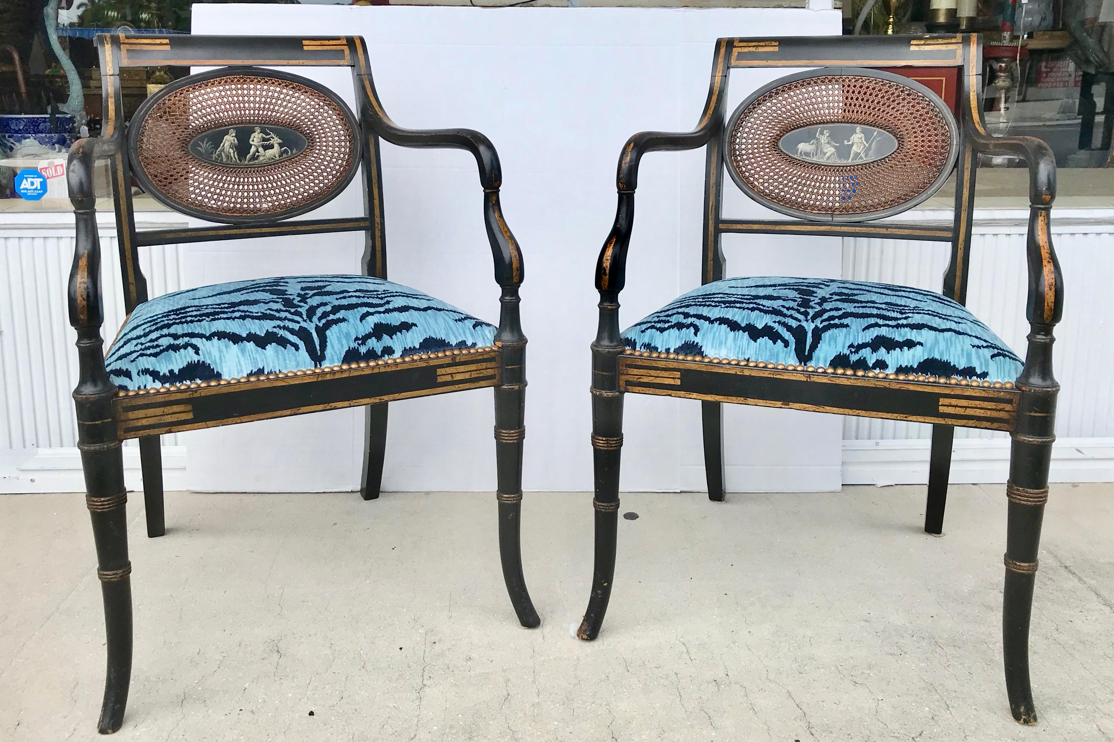 A Classic and fine pair of 19th century chairs fashioned with neoclassic figures
adorning their back rests and appointed with fabulously eye-catching
Luigi Bevilacqua seats.