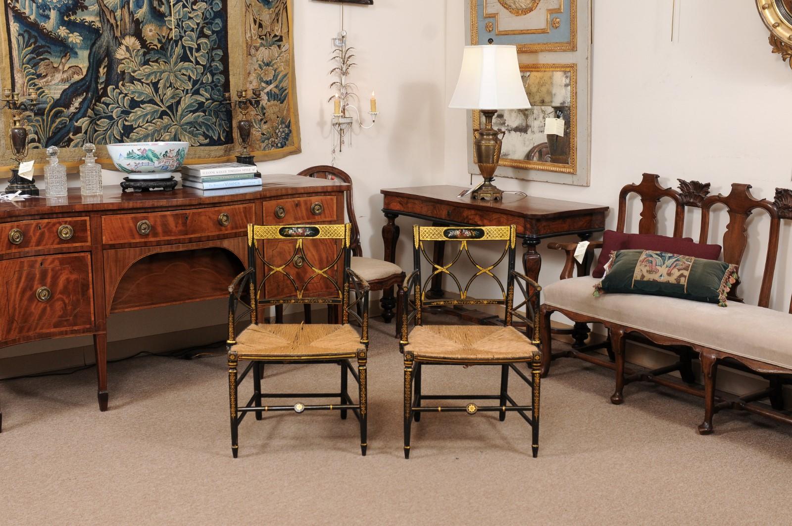 English  Pair of Regency Black Painted Arm Chairs with Floral Decoration & Rush Seats For Sale