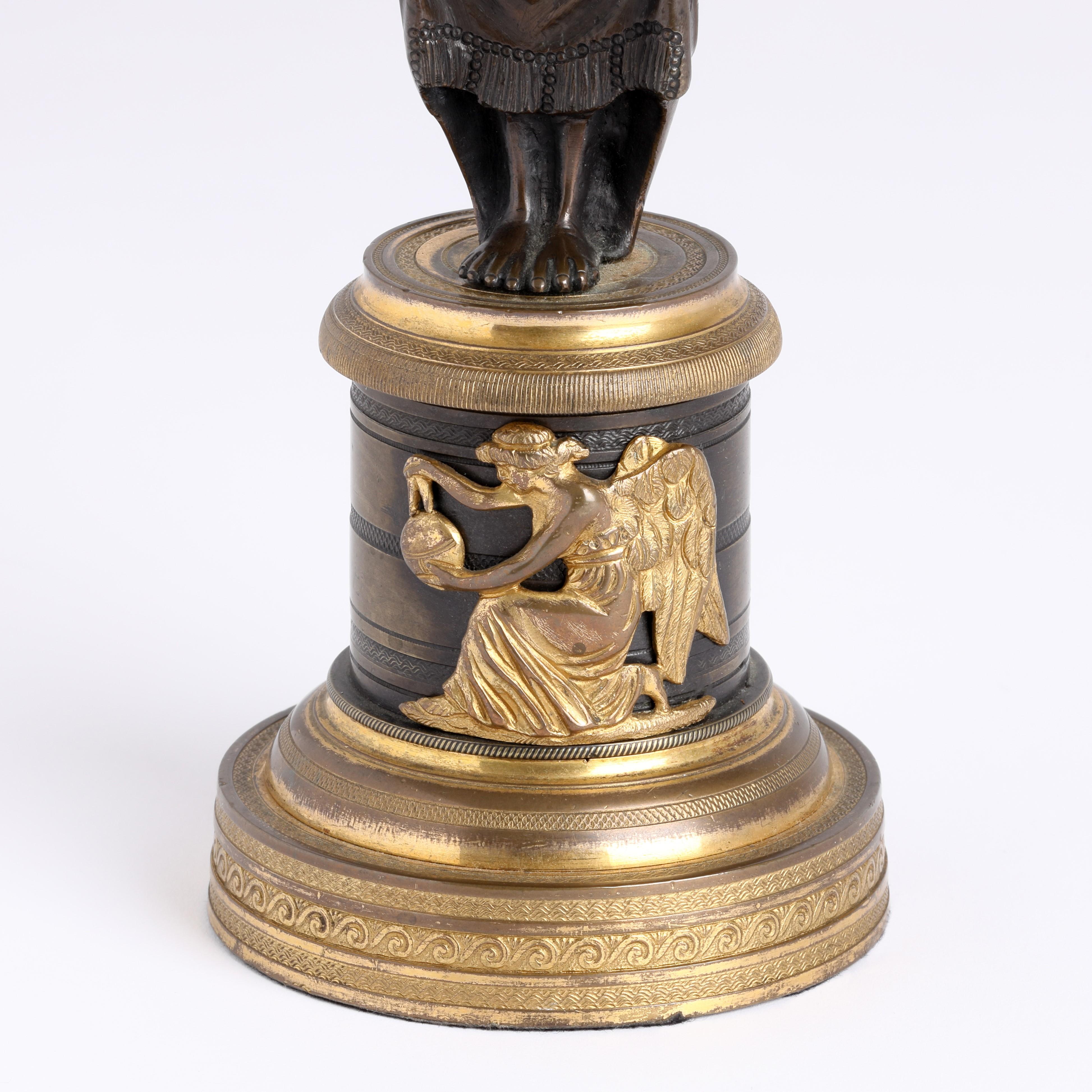Cast Pair of Regency Bronze and ormolu figural Candlesticks For Sale
