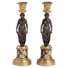 Pareja de candeleros figurados de bronce y ormolina de la Regencia