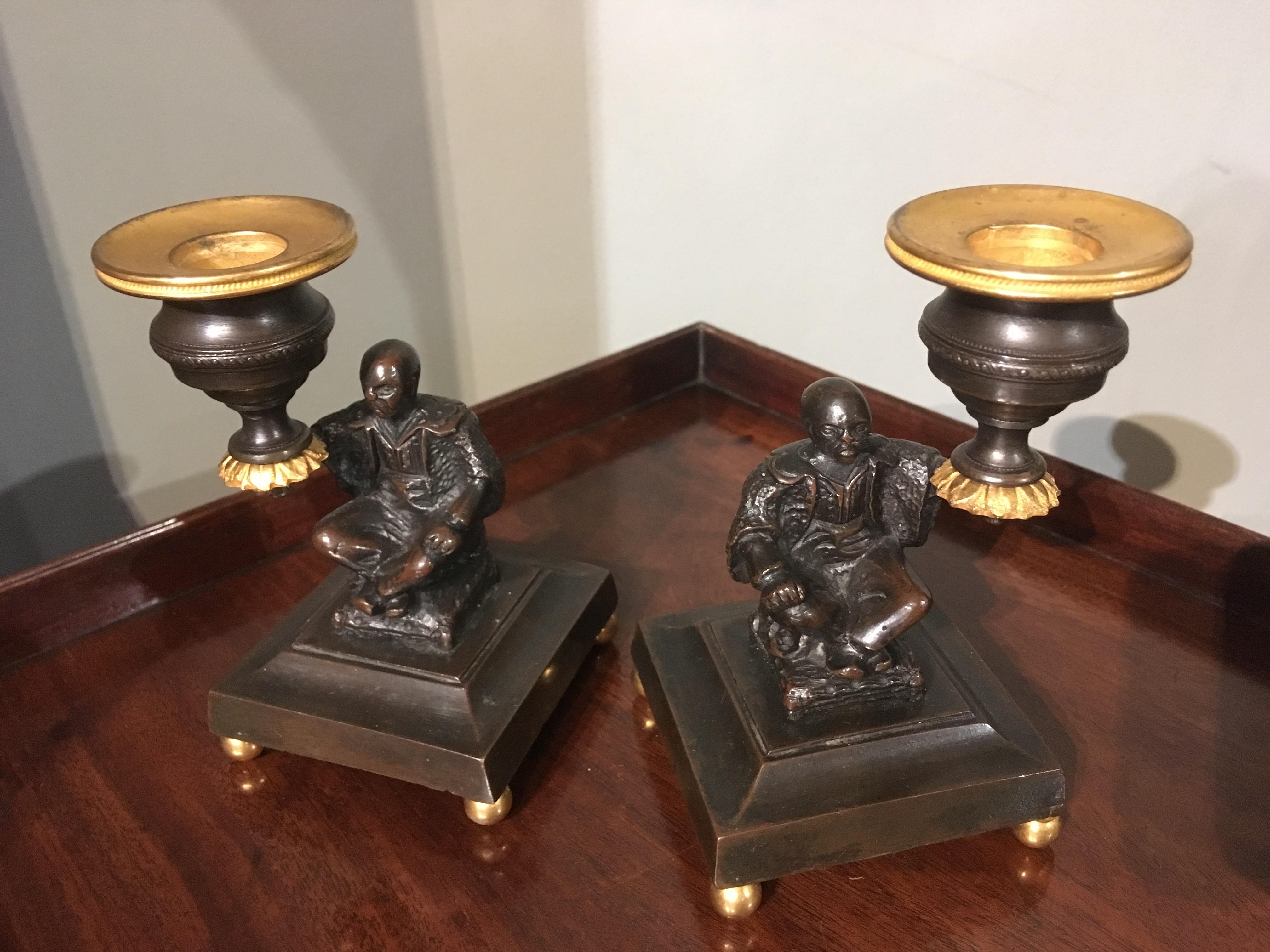 English Pair of Regency Bronze and Gilt Brass Candlesticks depicting seated Chinamen For Sale