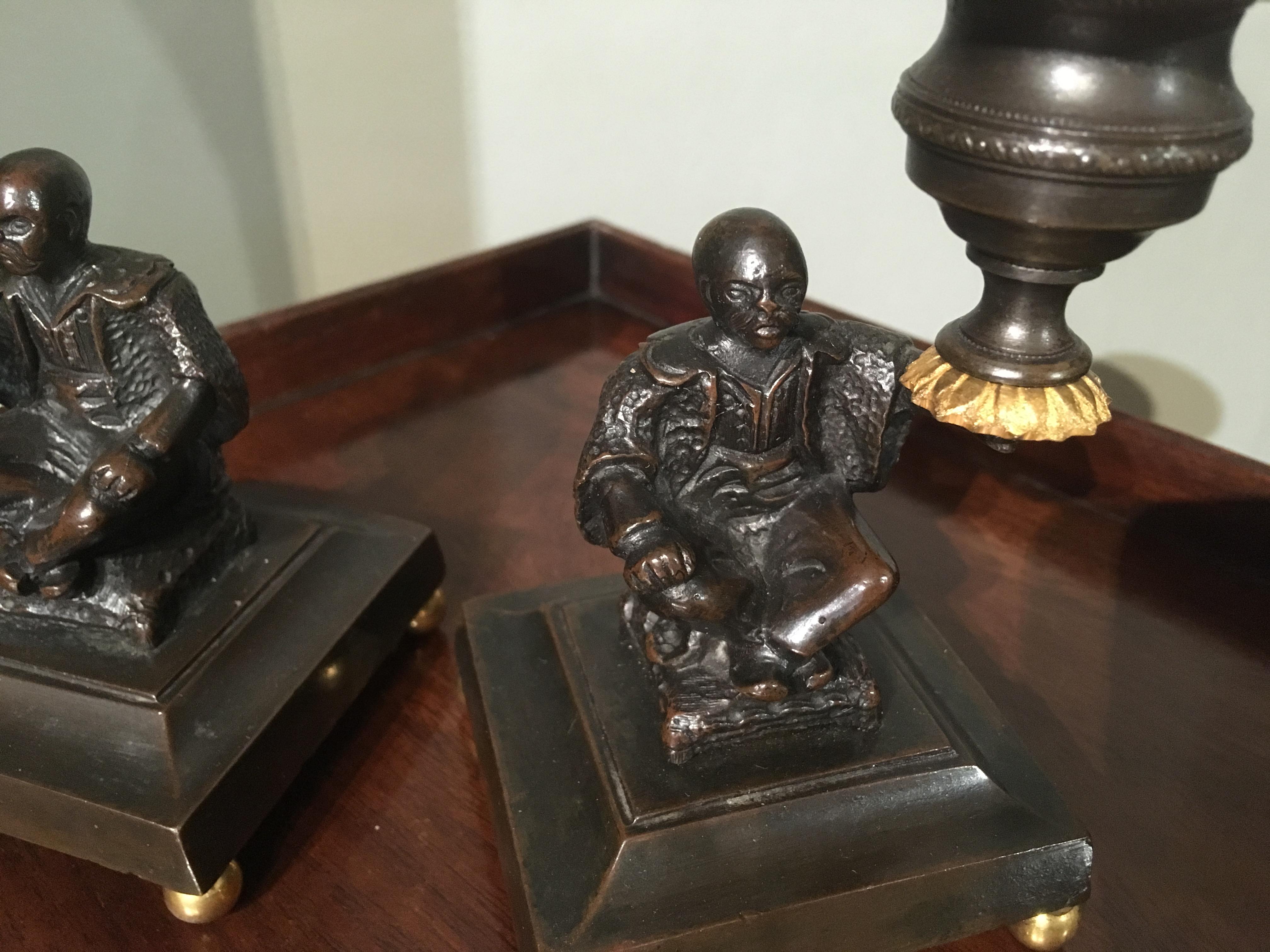 Pair of Regency Bronze and Gilt Brass Candlesticks depicting seated Chinamen In Good Condition For Sale In Bradford on Avon, GB