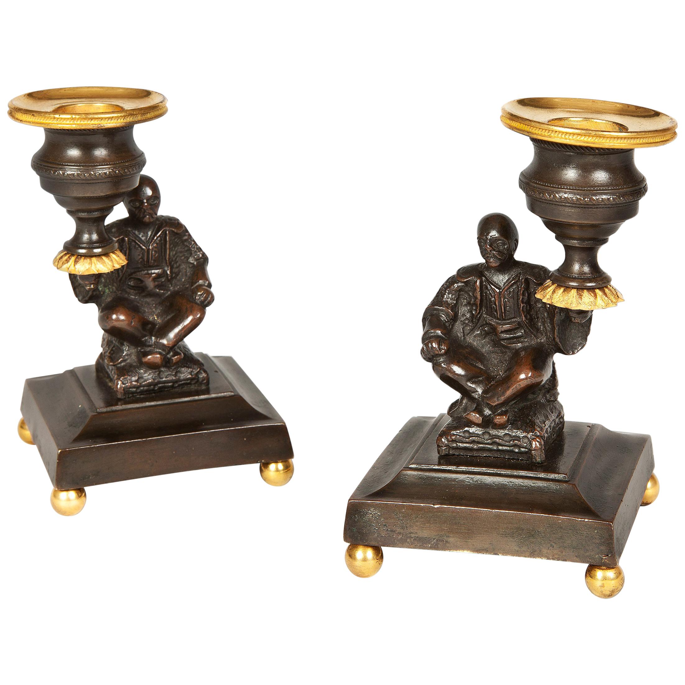 Pair of Regency Bronze and Gilt Brass Candlesticks depicting seated Chinamen For Sale