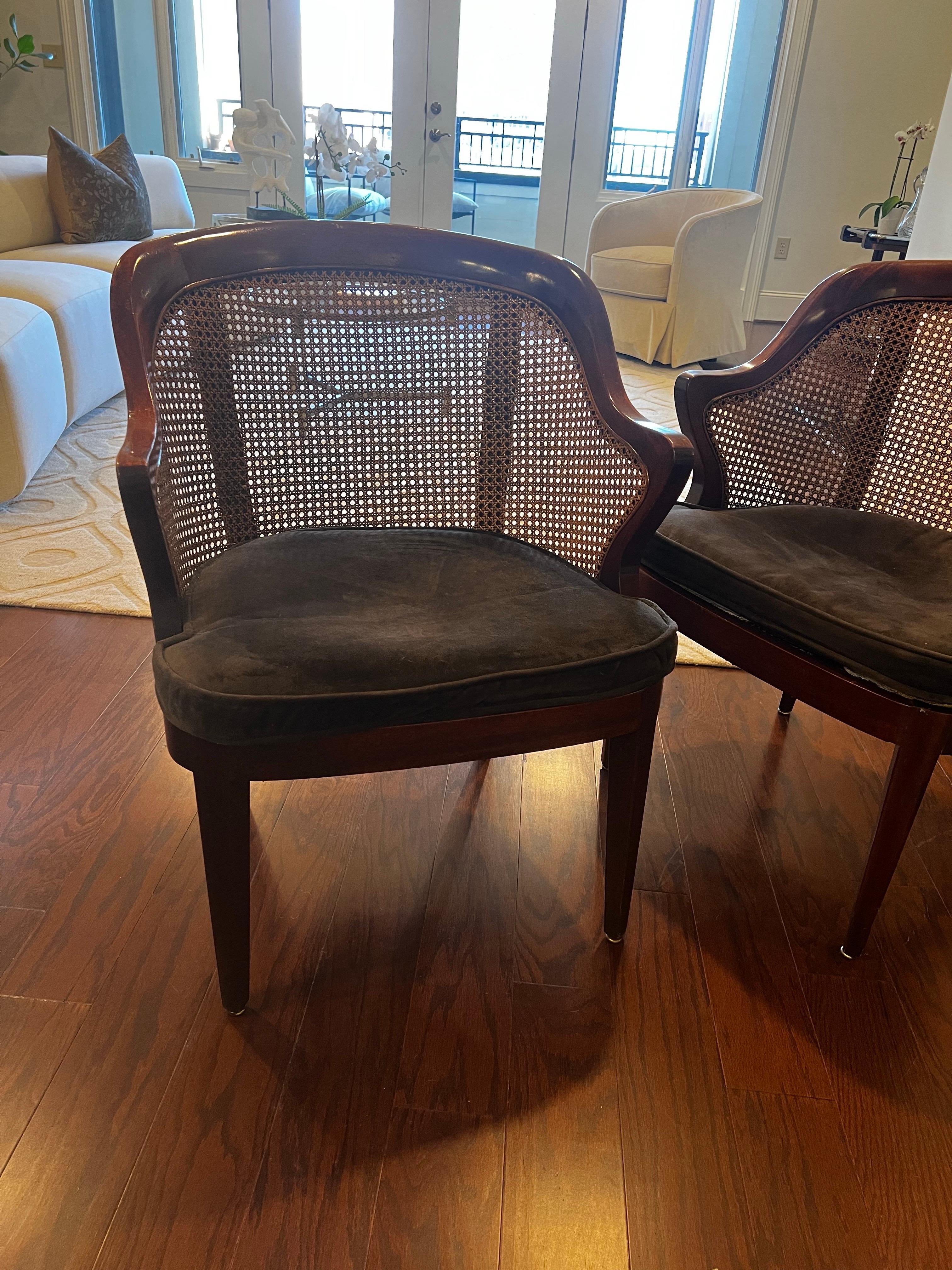 Gorgeous smart library chairs.   Curved back and arms with cane.  
They have a brown velvet cushion.

Chairs are strong and solid.  Seat Height is 16