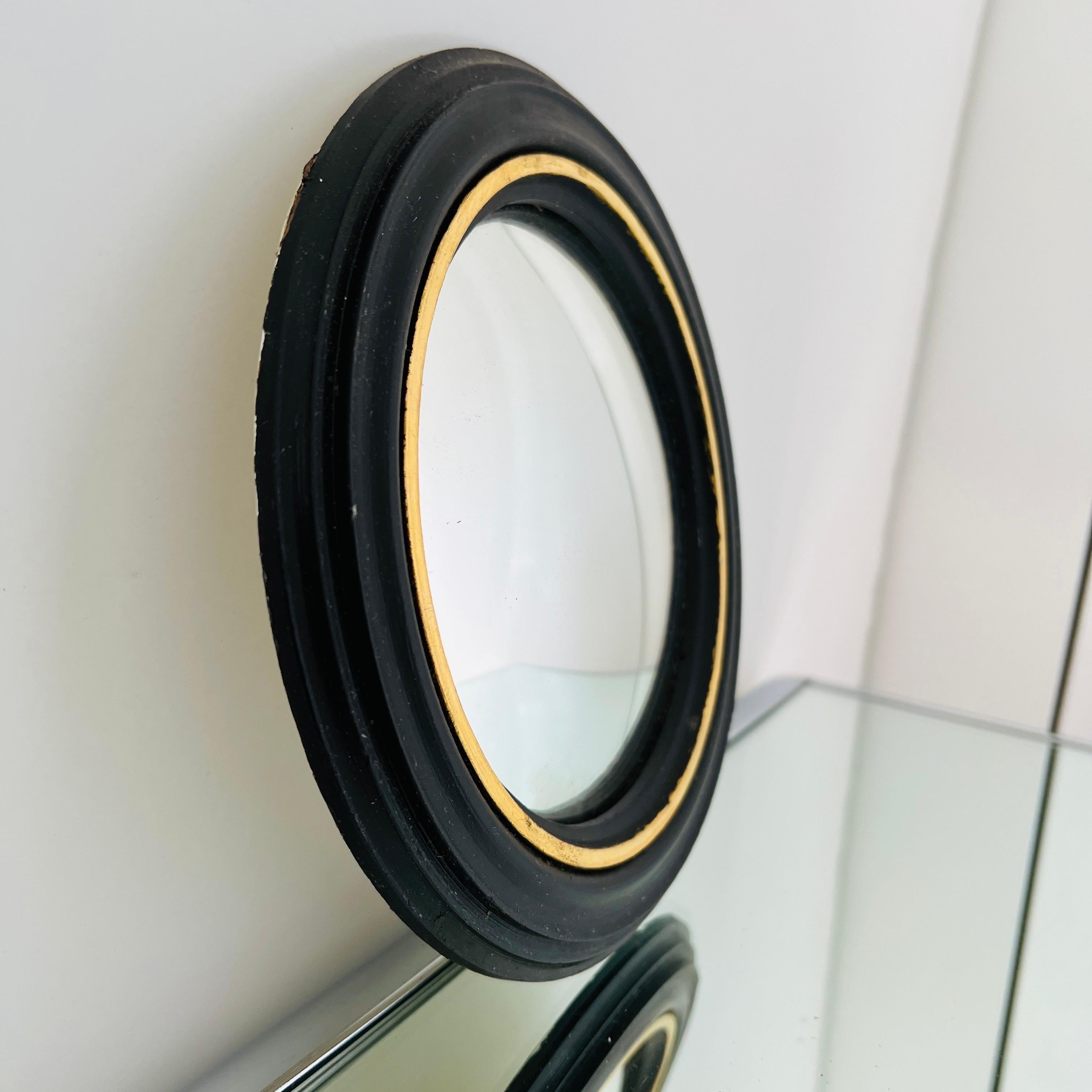 Late 20th Century Pair of Regency Convex Bullseye Mirrors in Black Plaster and Gold Leaf