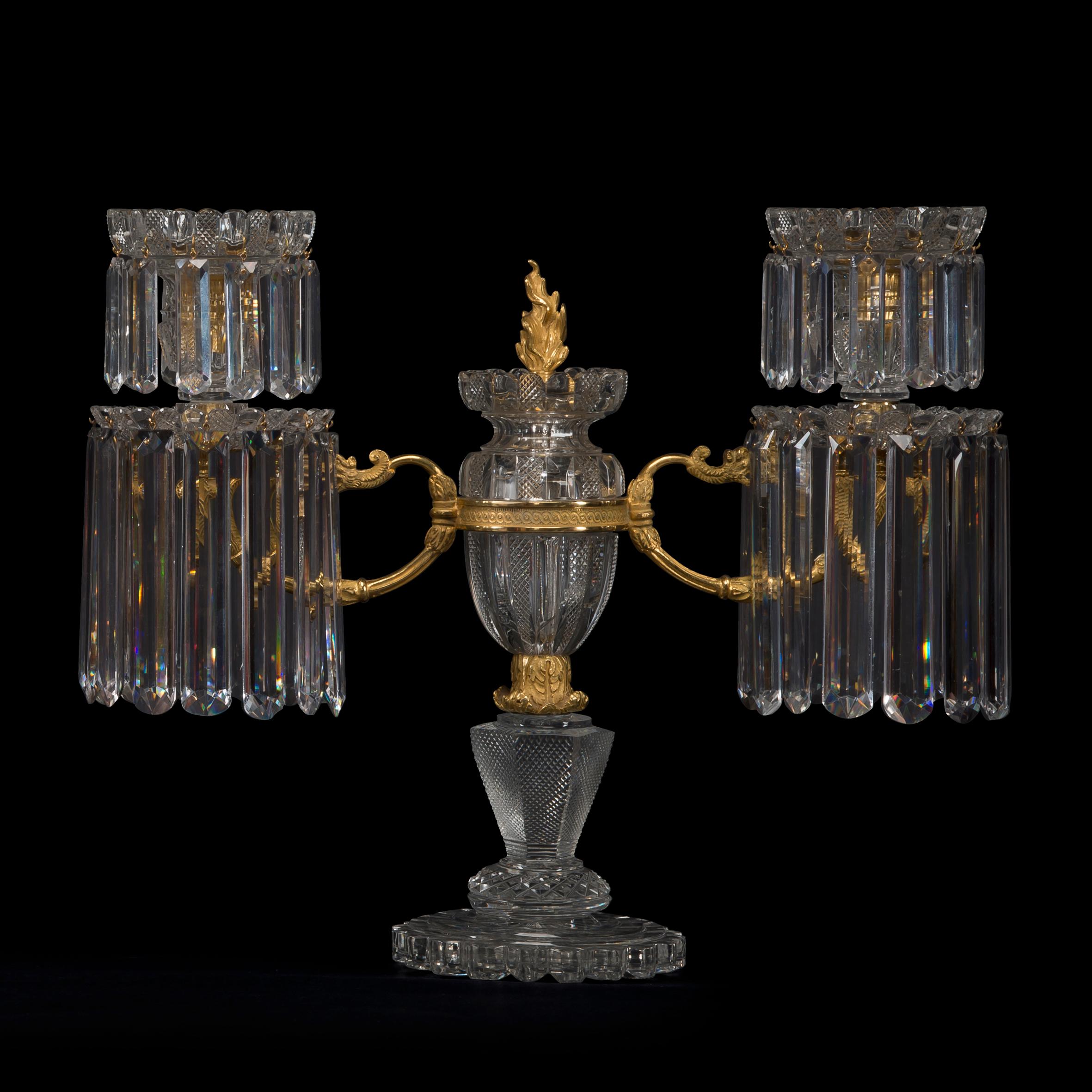 A rare pair of Regency twin-light gilt bronze mounted, pillar and file cut, glass candelabra by John Blades.

The firm of John Blades was first recorded in the London guide for 1783 at 5 Ludgate Hill, remaining at this address until 1829. The firm