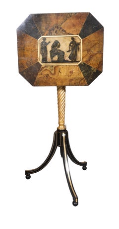 Coppia di candelabri Regency in legno dorato ed ebanizzato