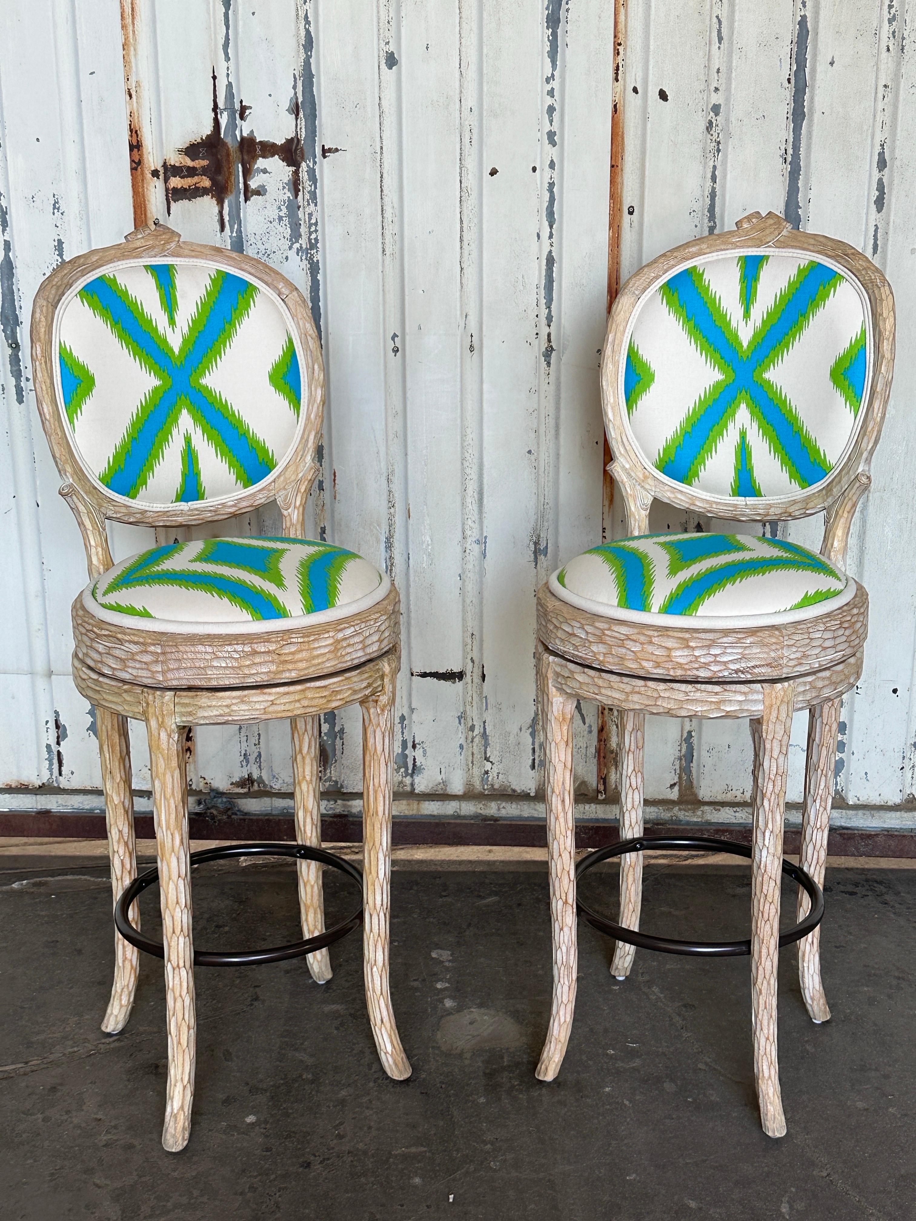 Pair of Palm Beach Regency faux bois twig swiveling barstools. Made of hand carved European beechwood in 1980’s in Spain. We also have matching set of 8 dining chairs available in our other listing.